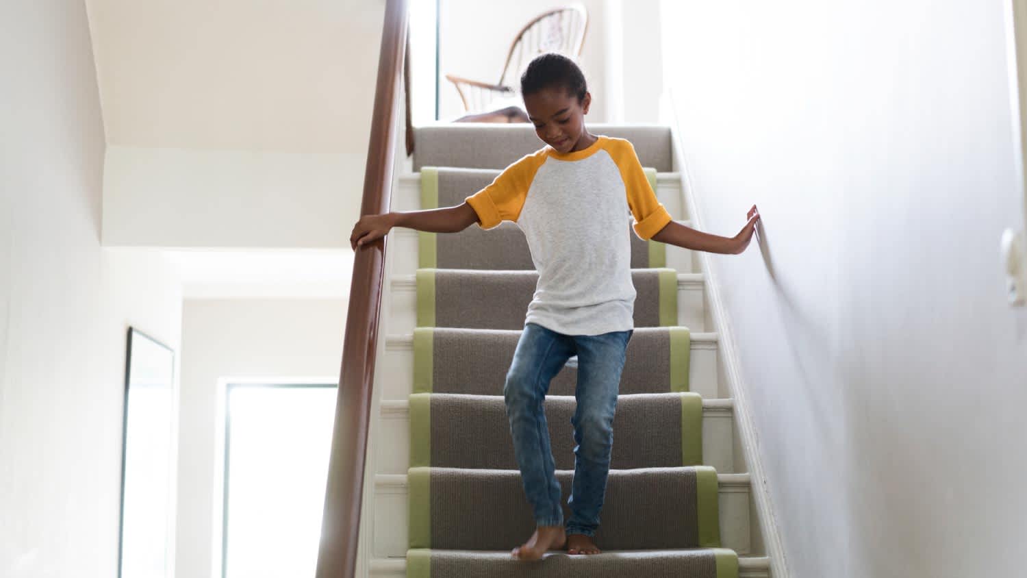 A girl moving down on staircase