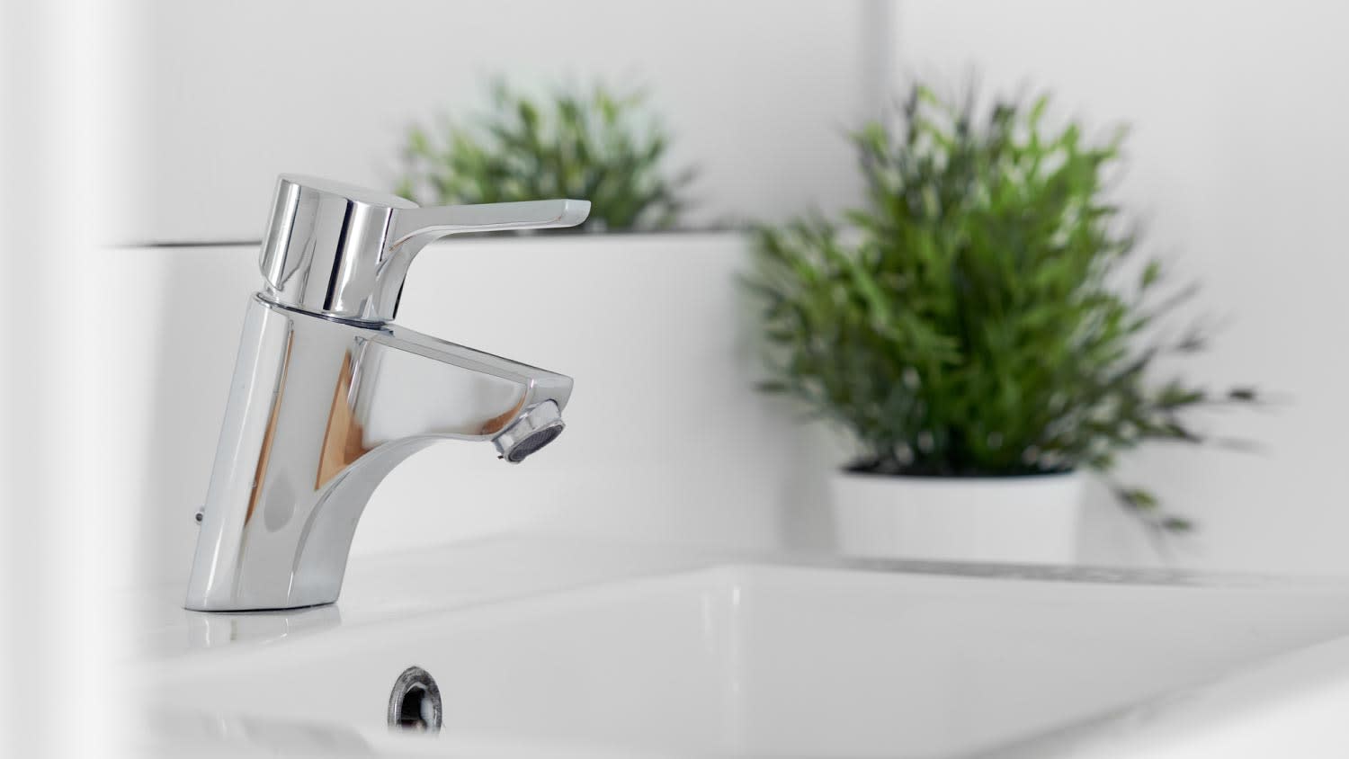 A metallic faucet in a bathroom