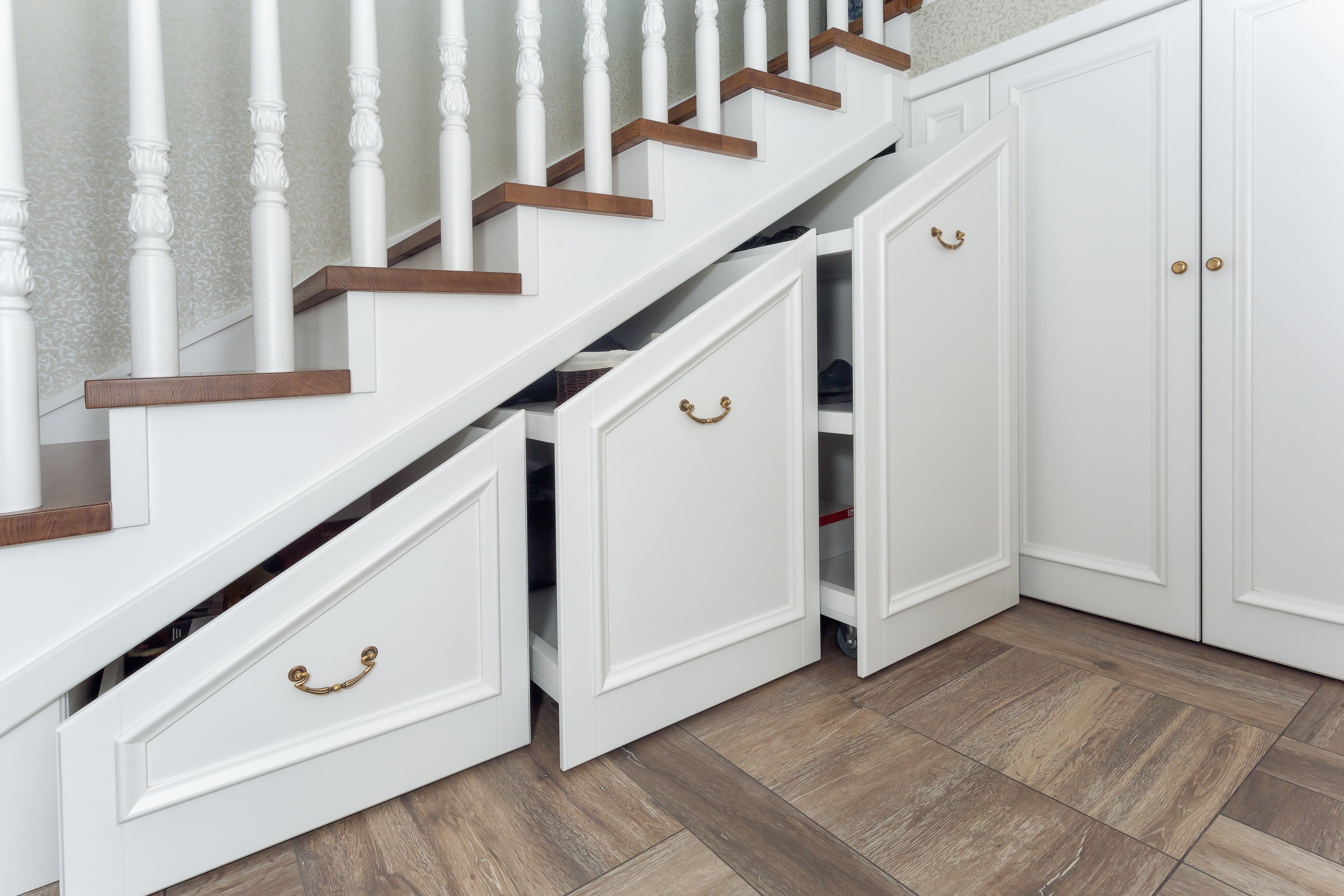 Pull-out storage system under wooden staircase