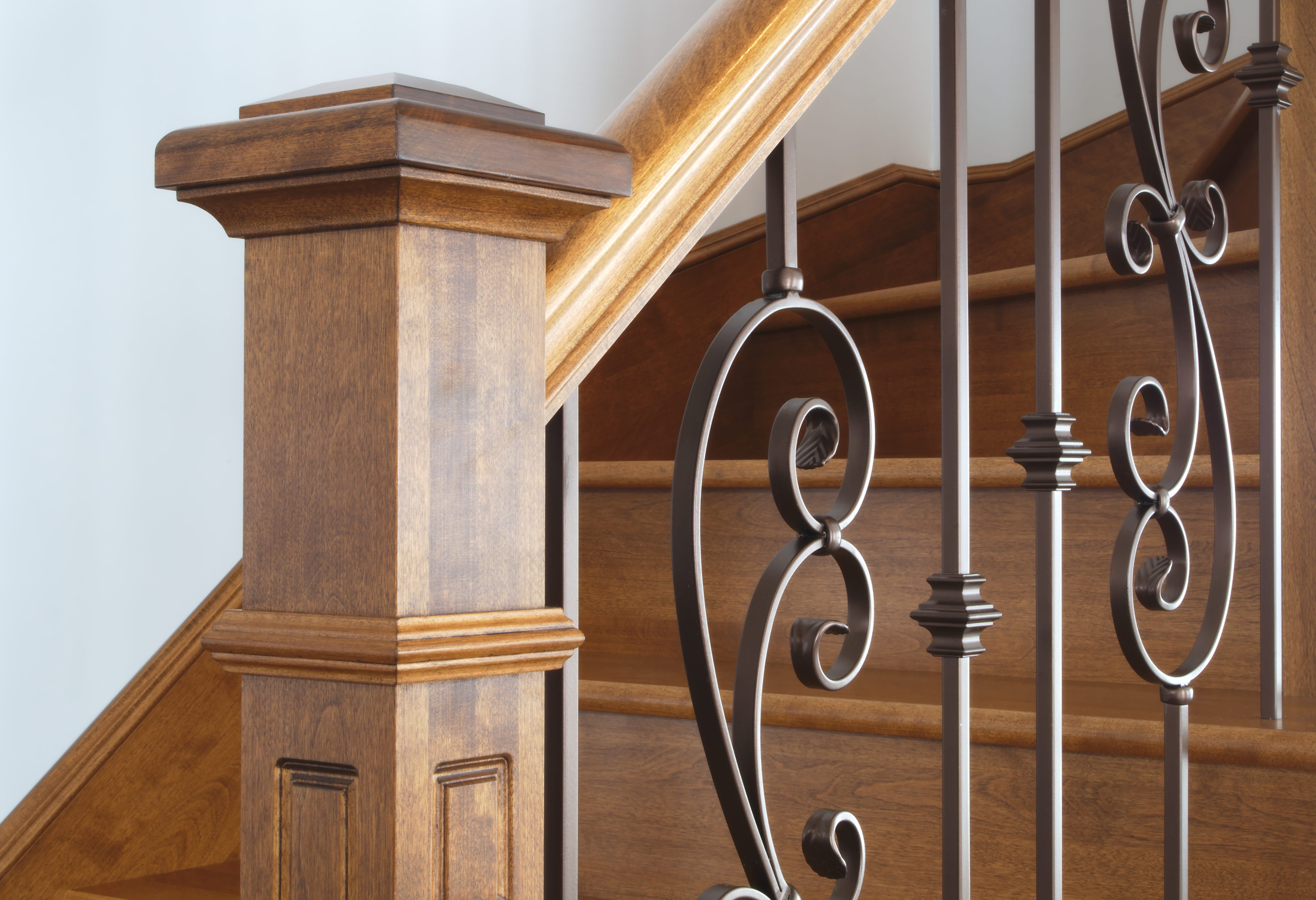 Wrought iron balusters on wooden staircase