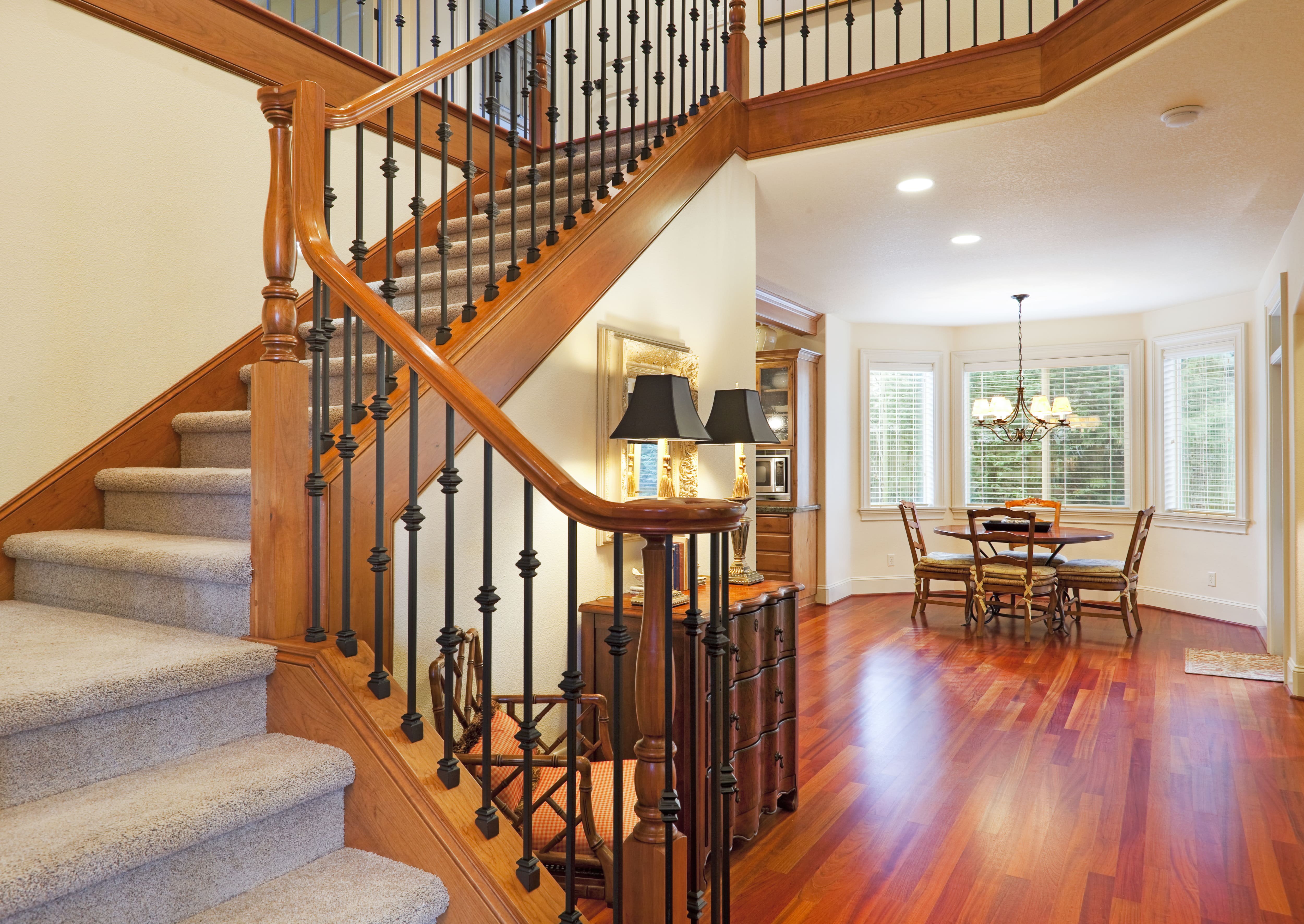 Grand staircase with carpeted stair treads