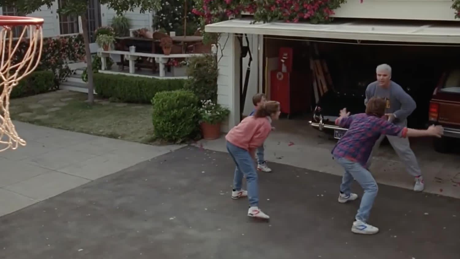 A family playing outside the house