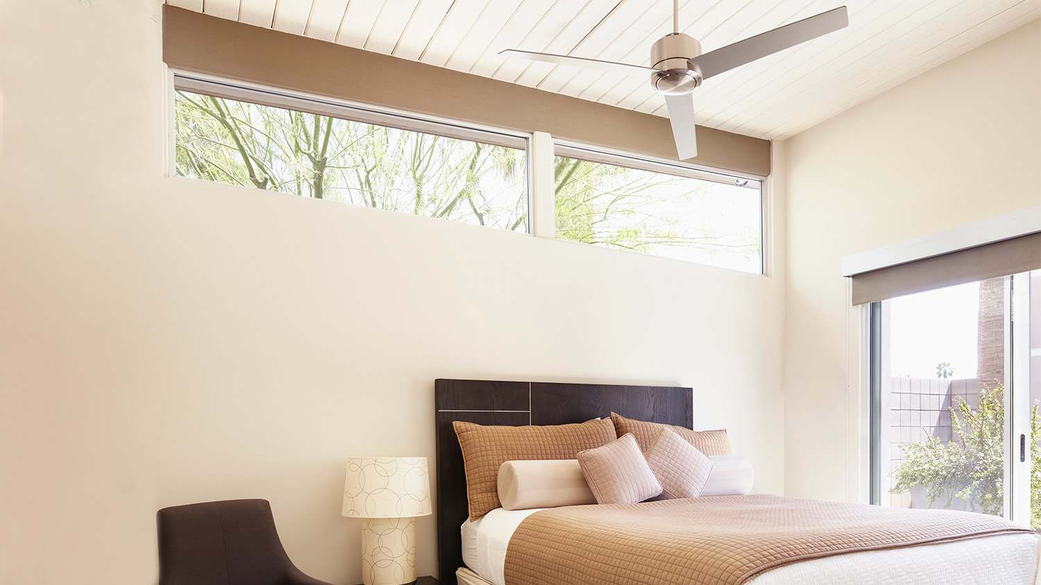 Sunny bedroom with ceiling fain