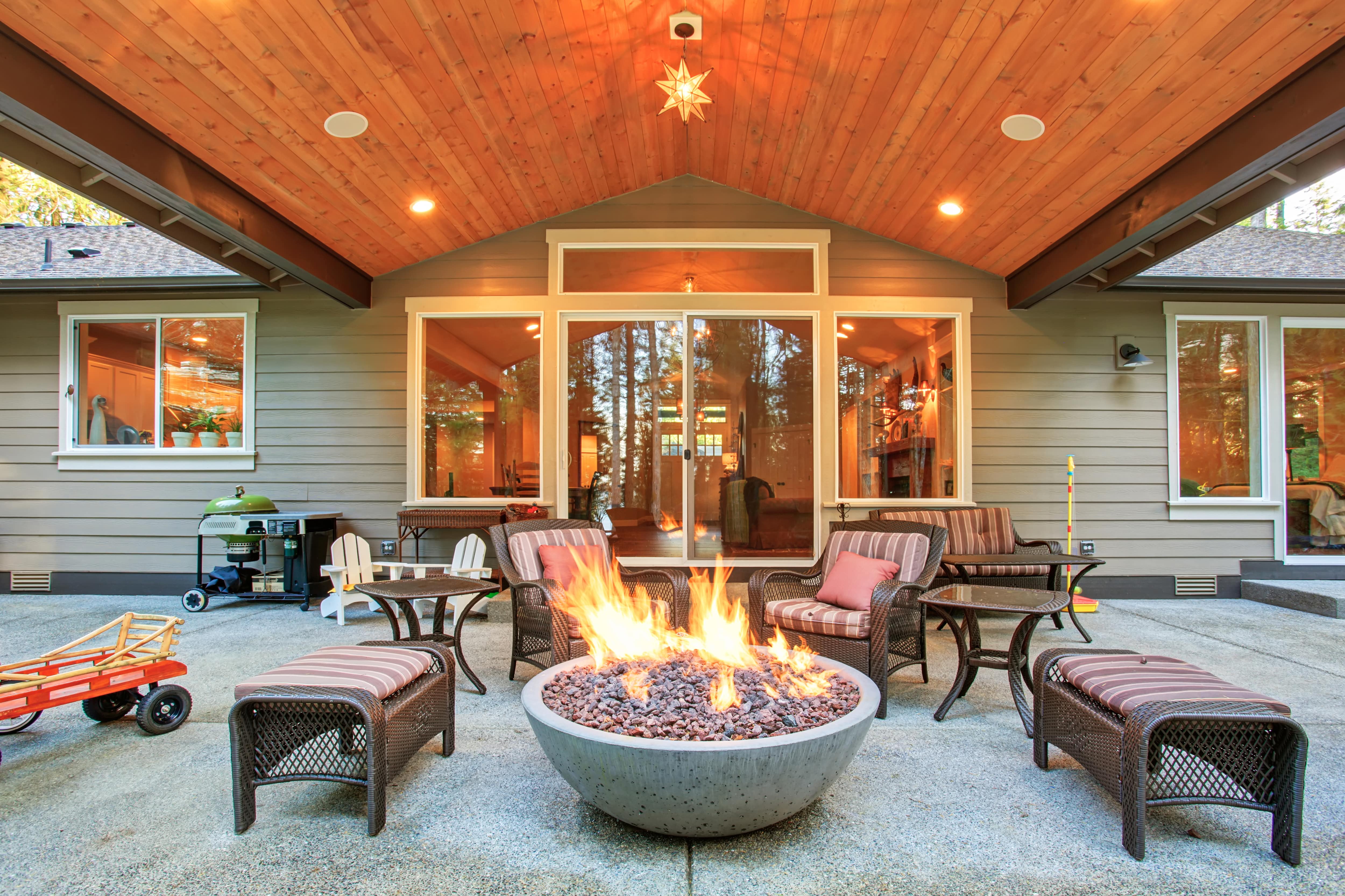 Concrete fire pit under large covered porch