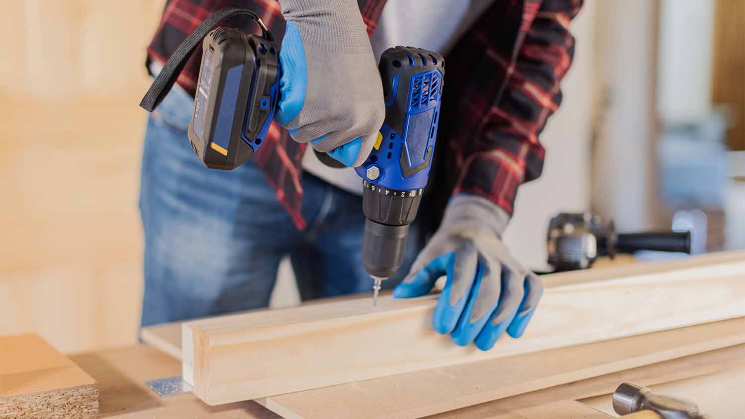 handyman using electric drill