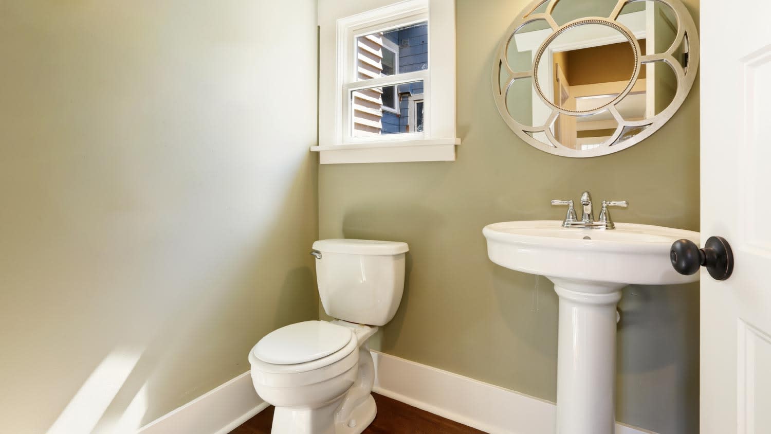 A bathroom with a pedestal washstand