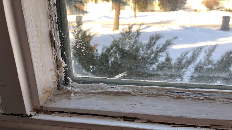 broken window with open draft