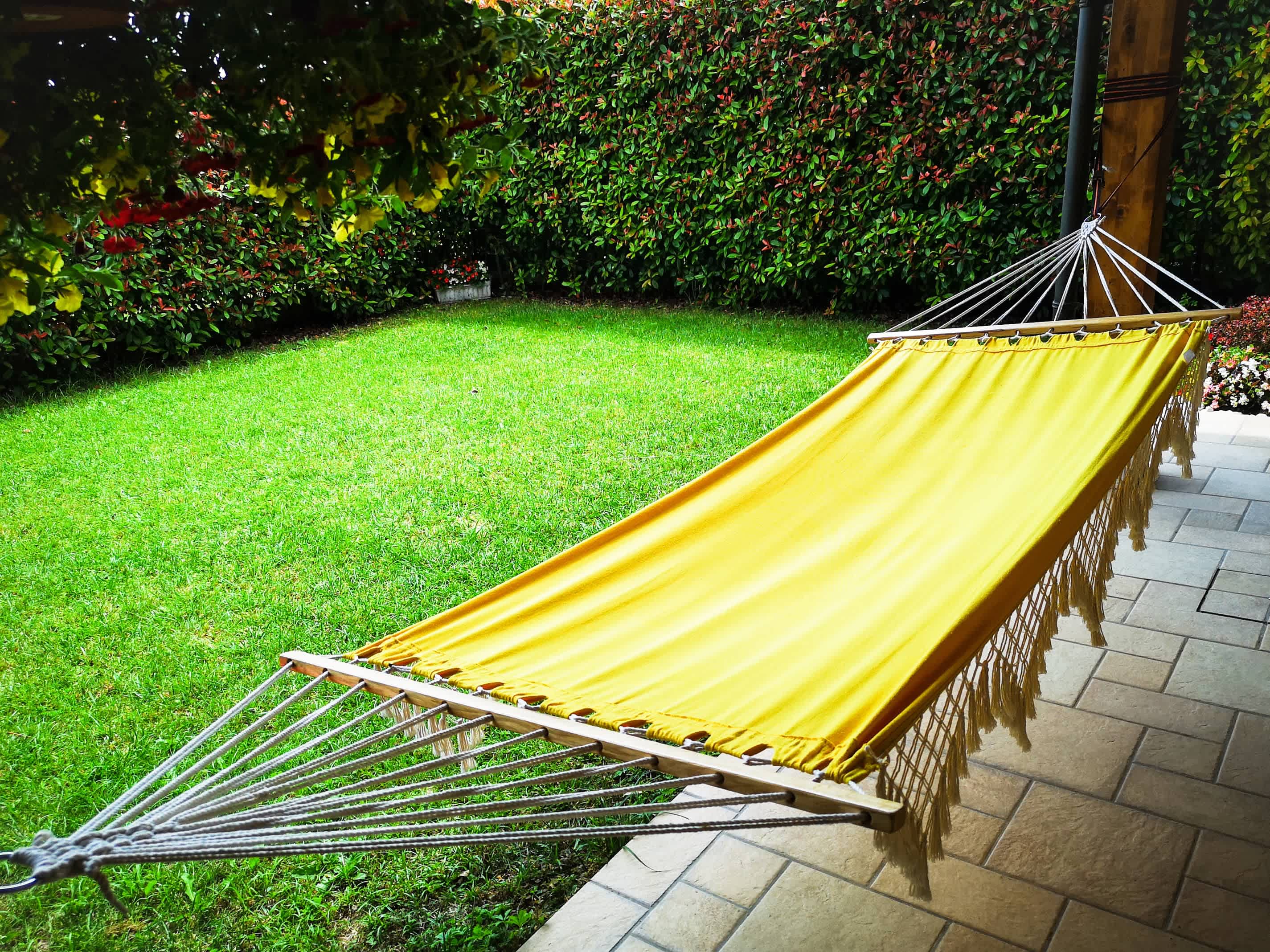 Yellow outdoor hammock in backyard