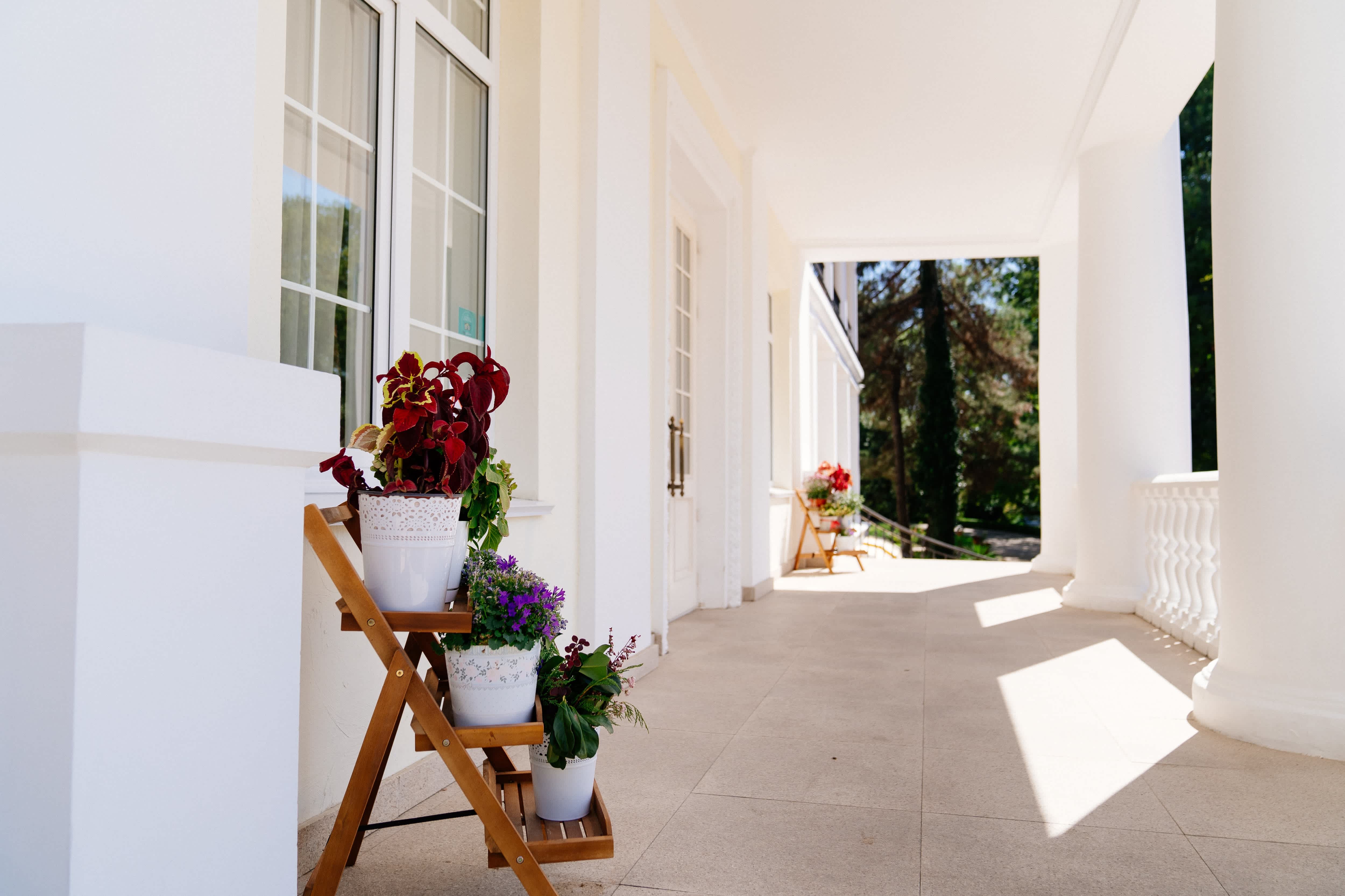 Tiered planter stand on covered veranda