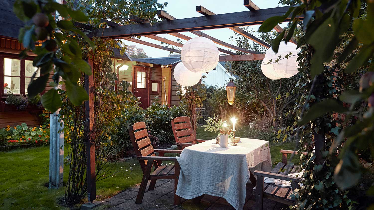 Pergola with plants and hanging lights