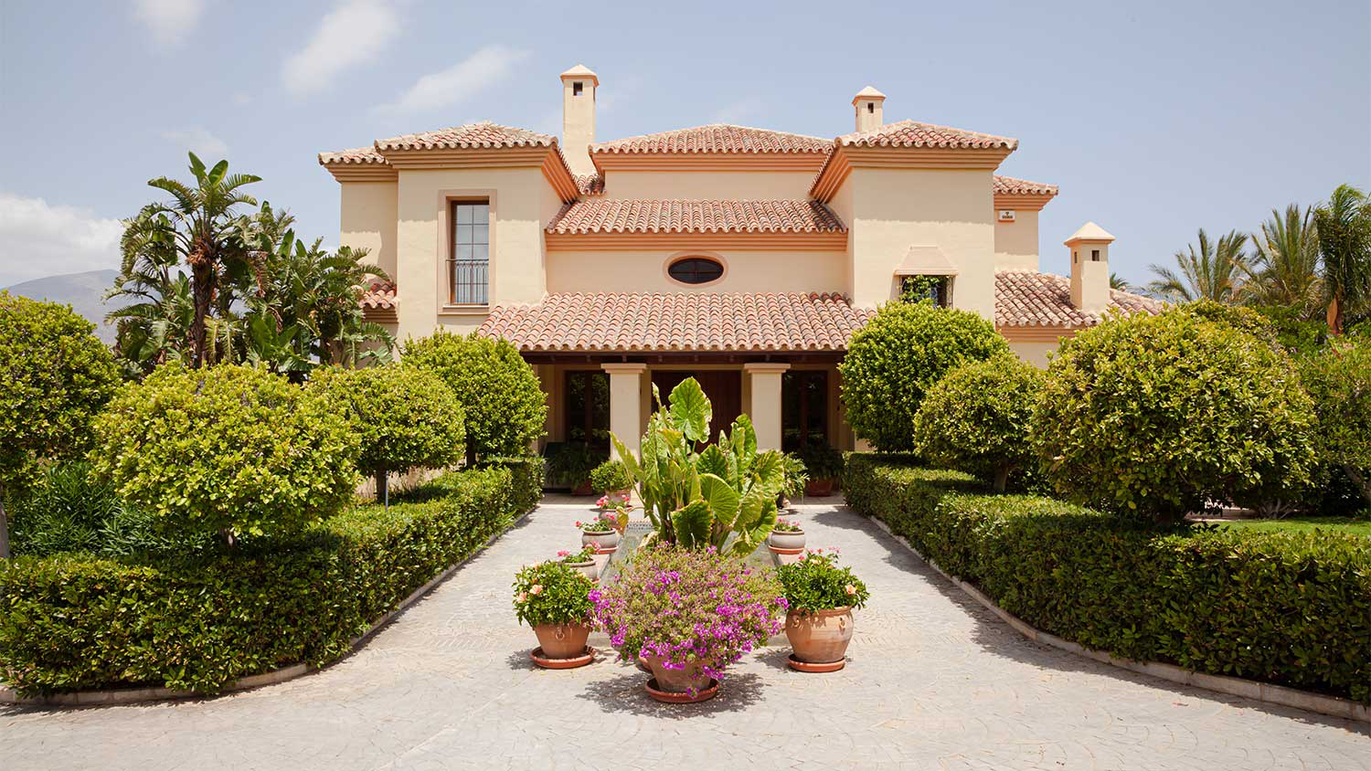 A view of the exterior of a stucco house