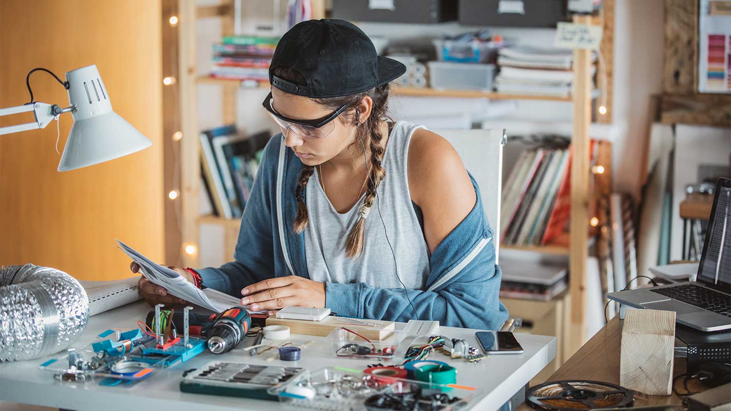 A woman looks at a manual