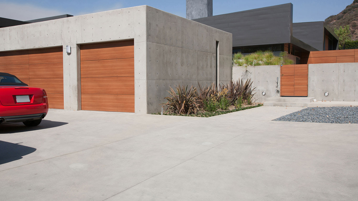 Modern concrete house exterior with two-car garage