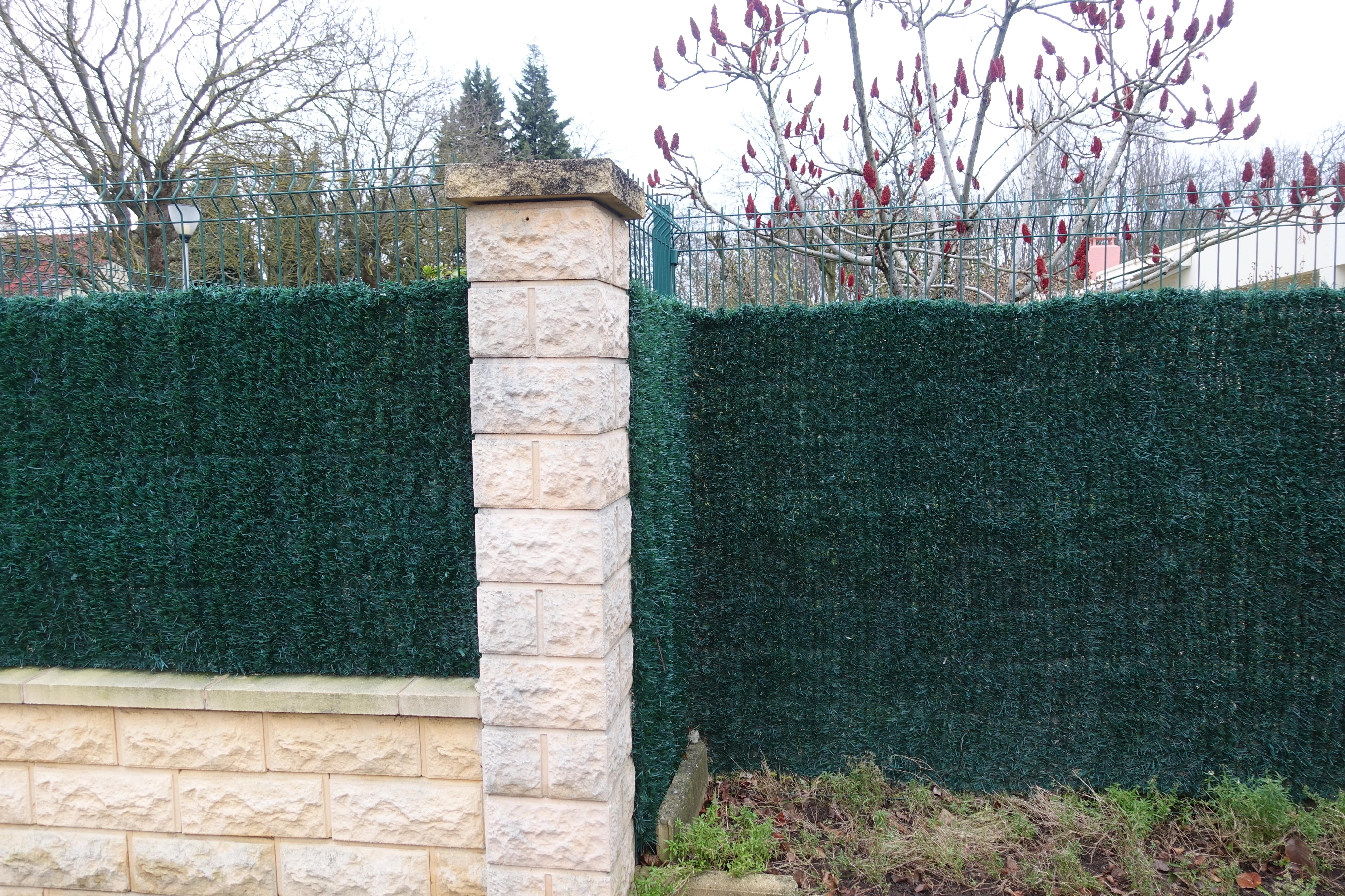 A corner shot of a privacy fence around a yard