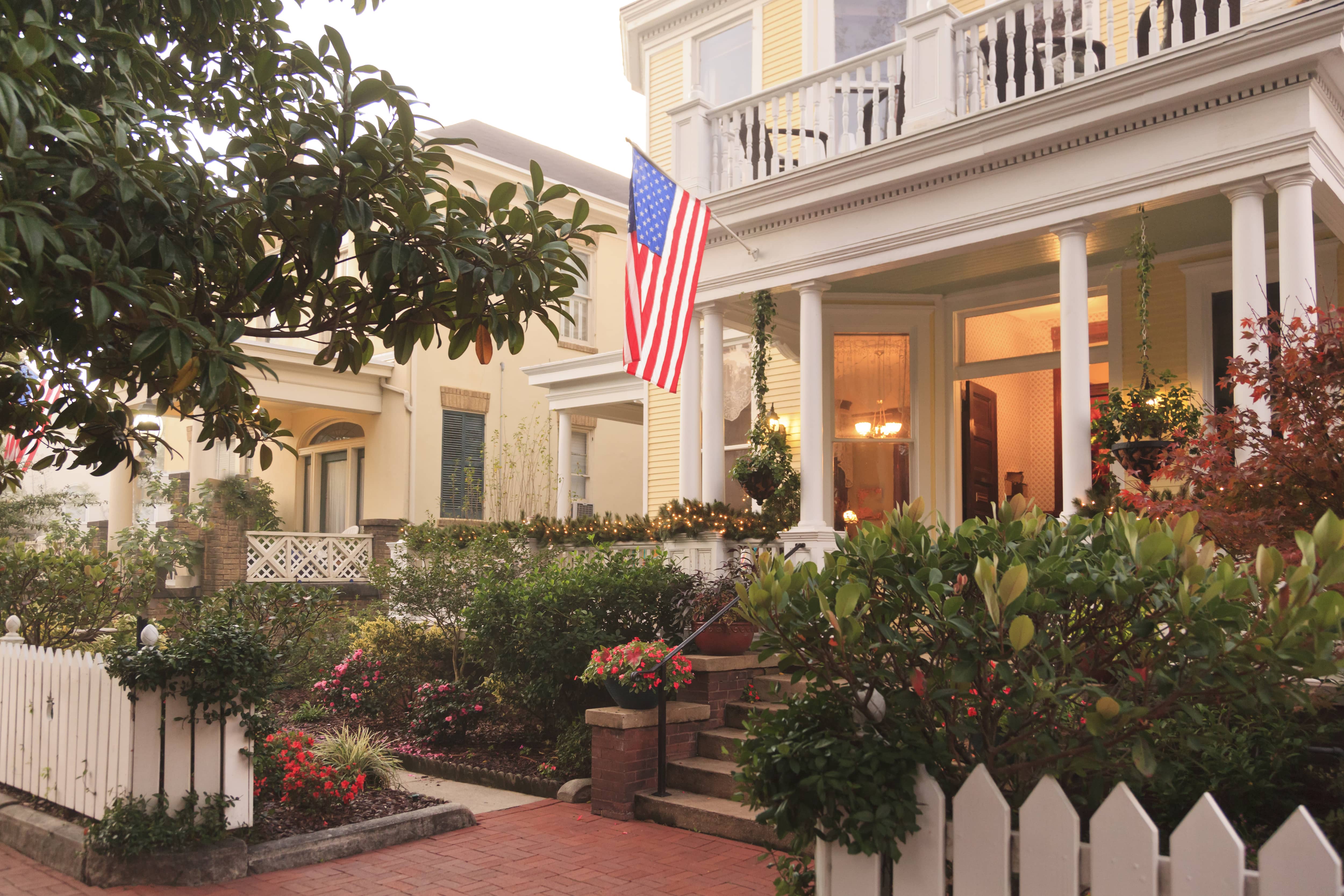 Grand front porch with attached flag pole