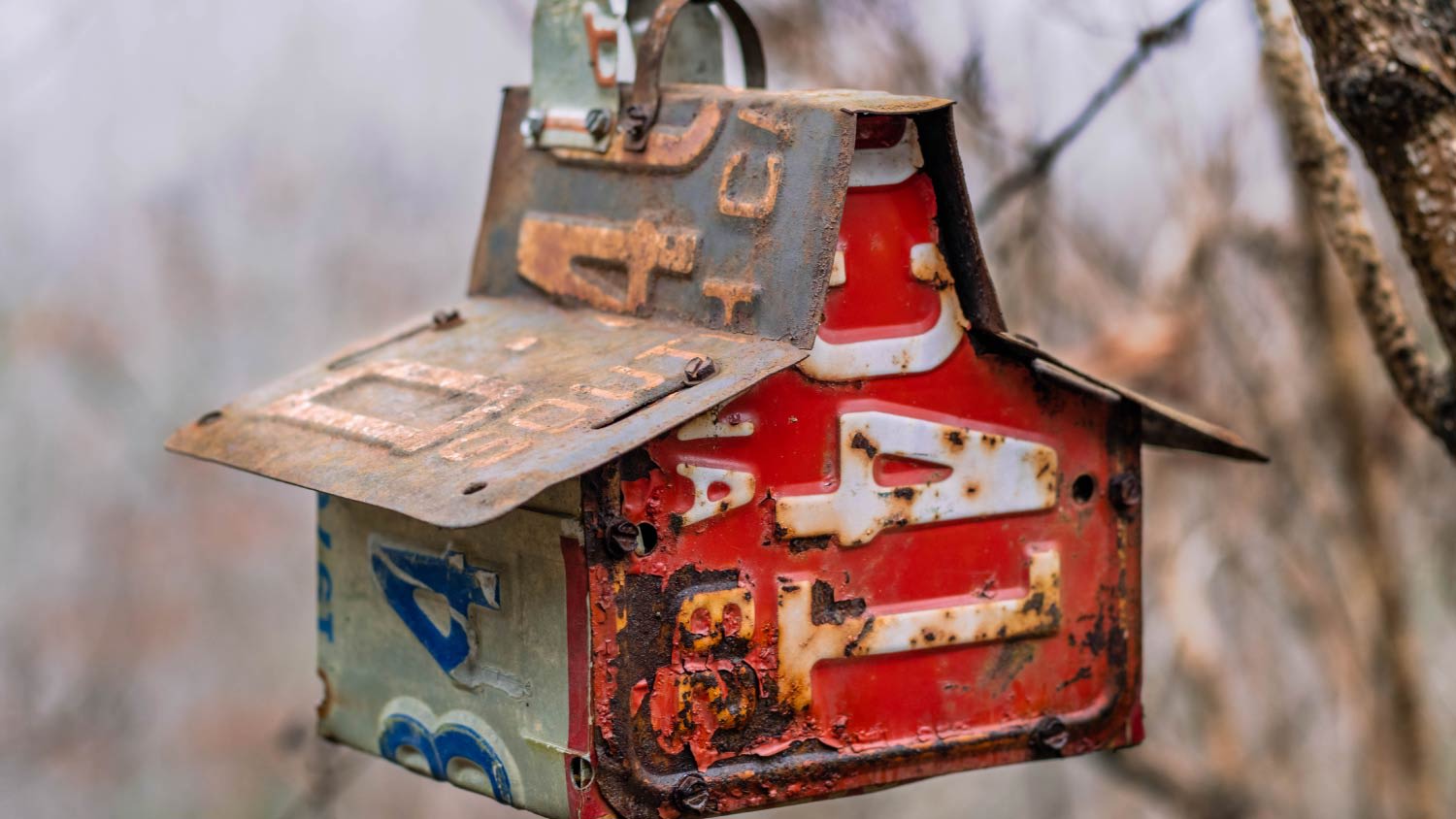 metal birdhouse made from license plates