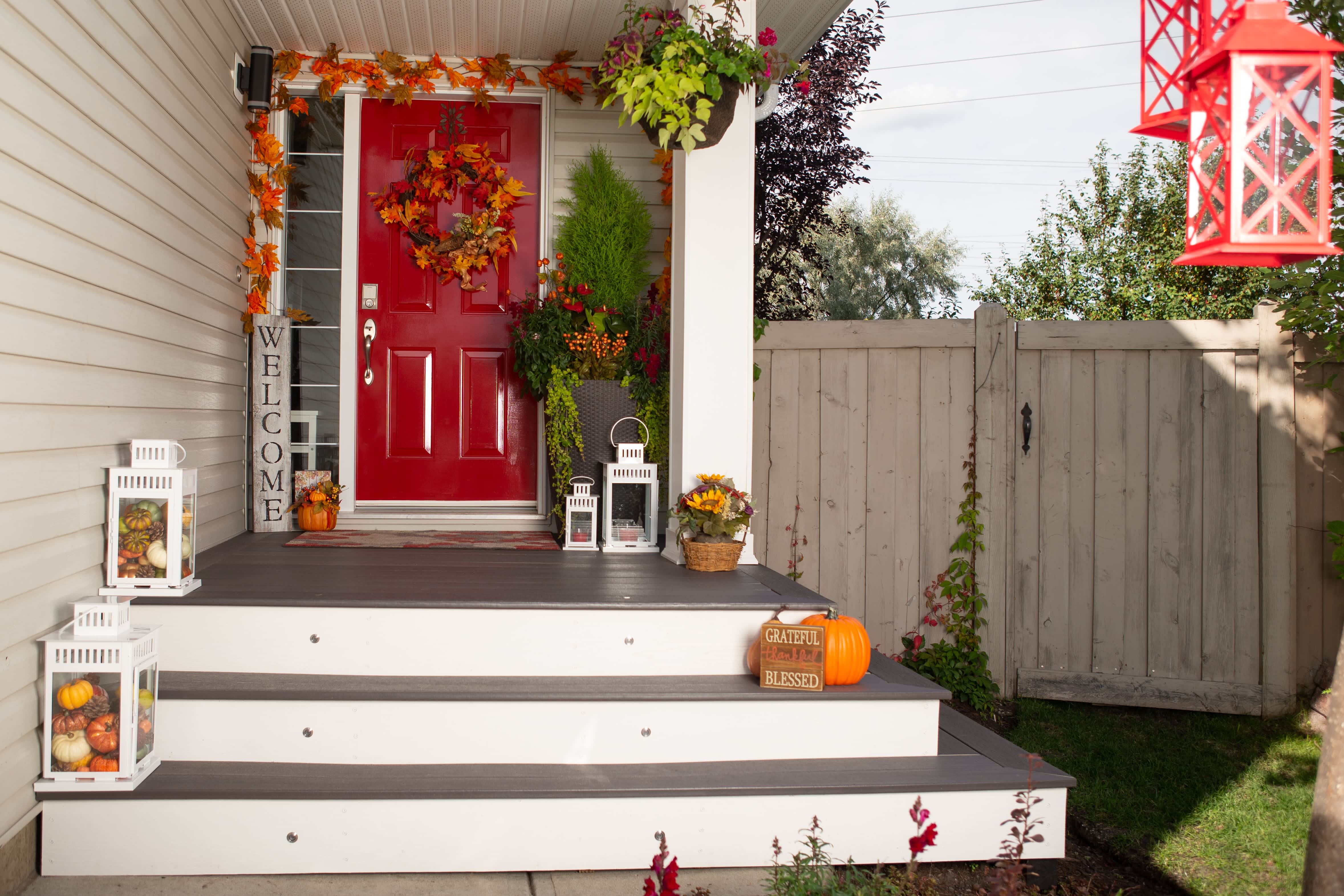 Decorative lanterns lining front porch stairs
