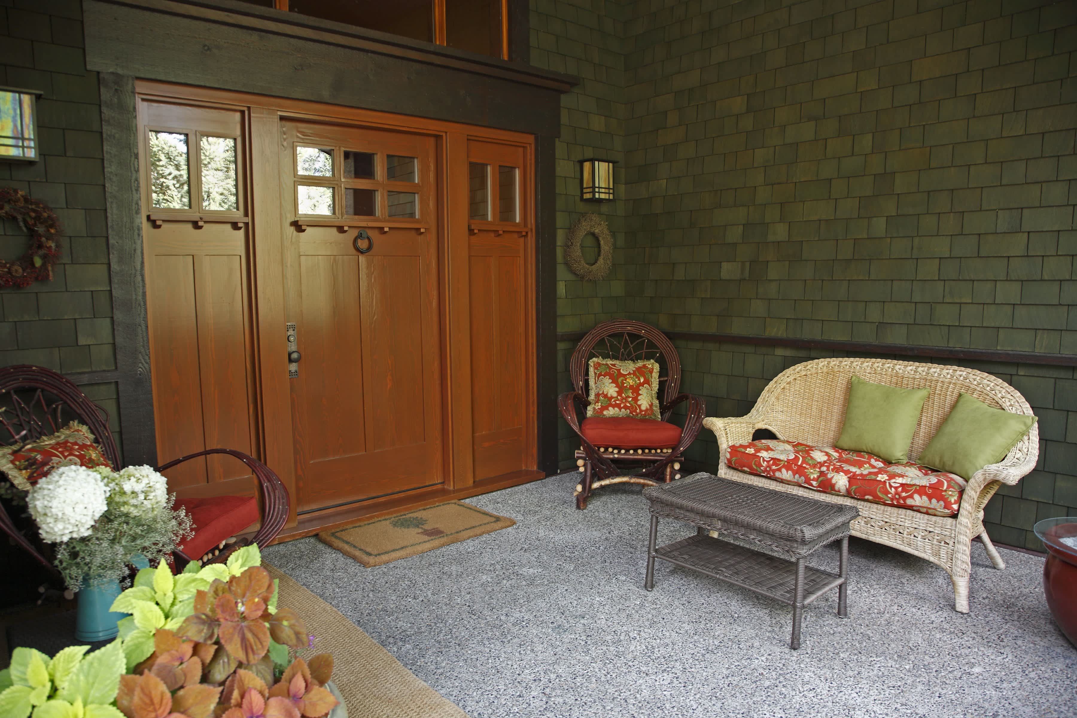 Earth-toned front porch color palette with wicker furniture