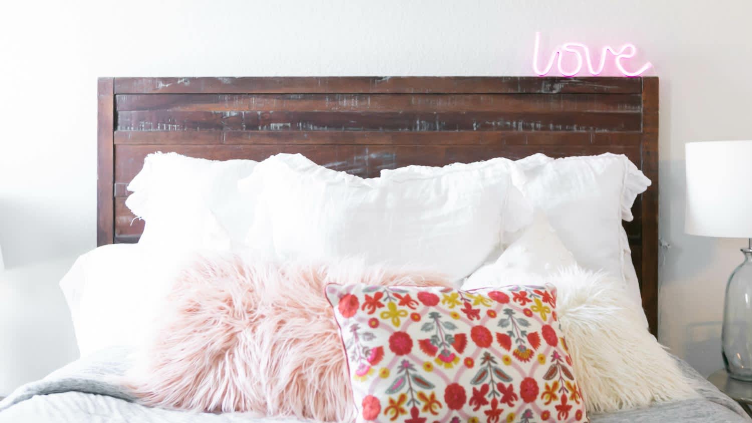 Modern bed with decorative pillows