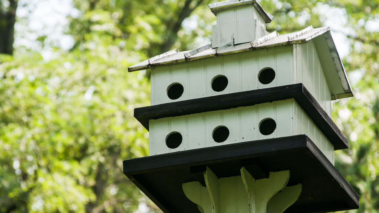 two-story green birdhouse