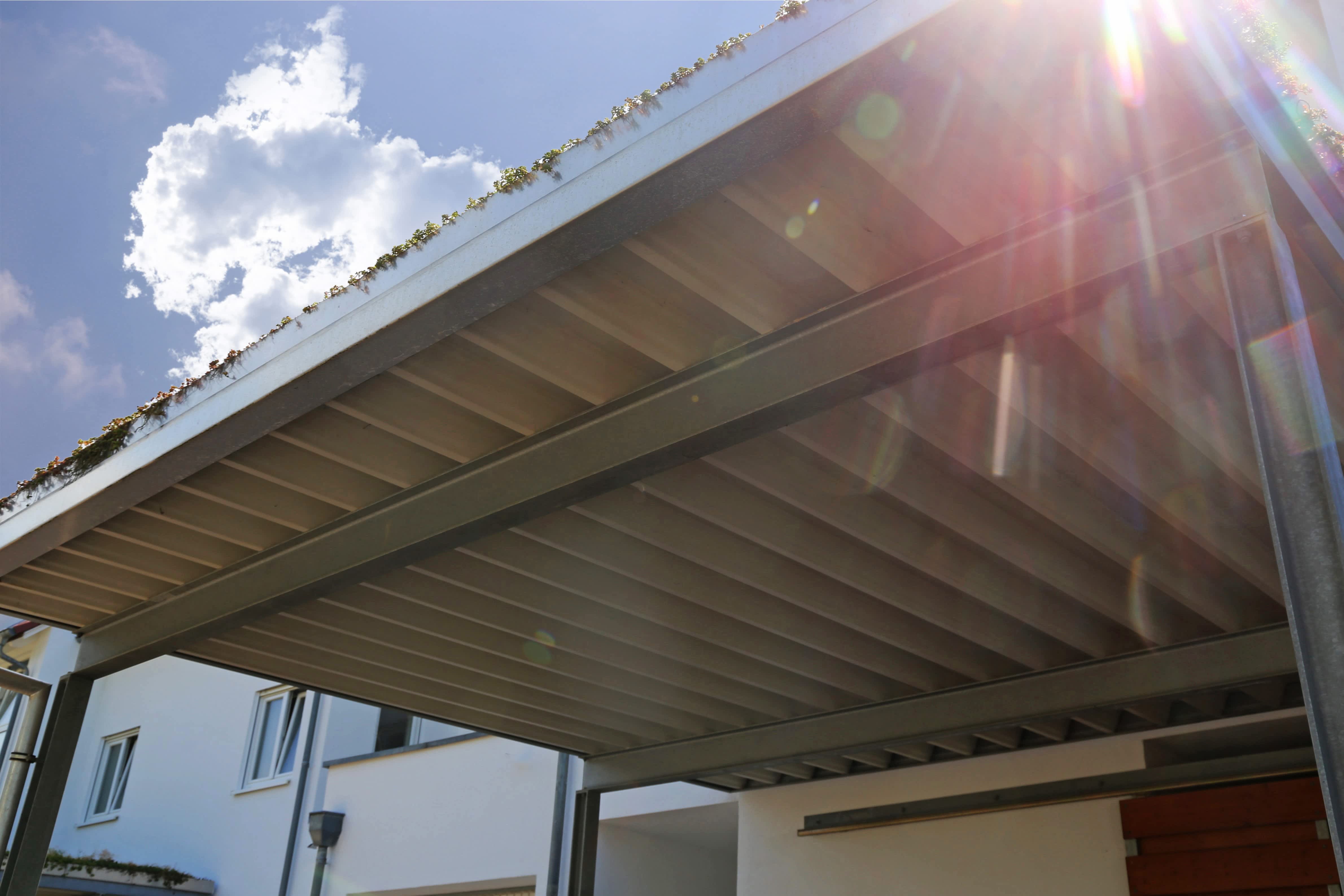Metal carport attached to modern home