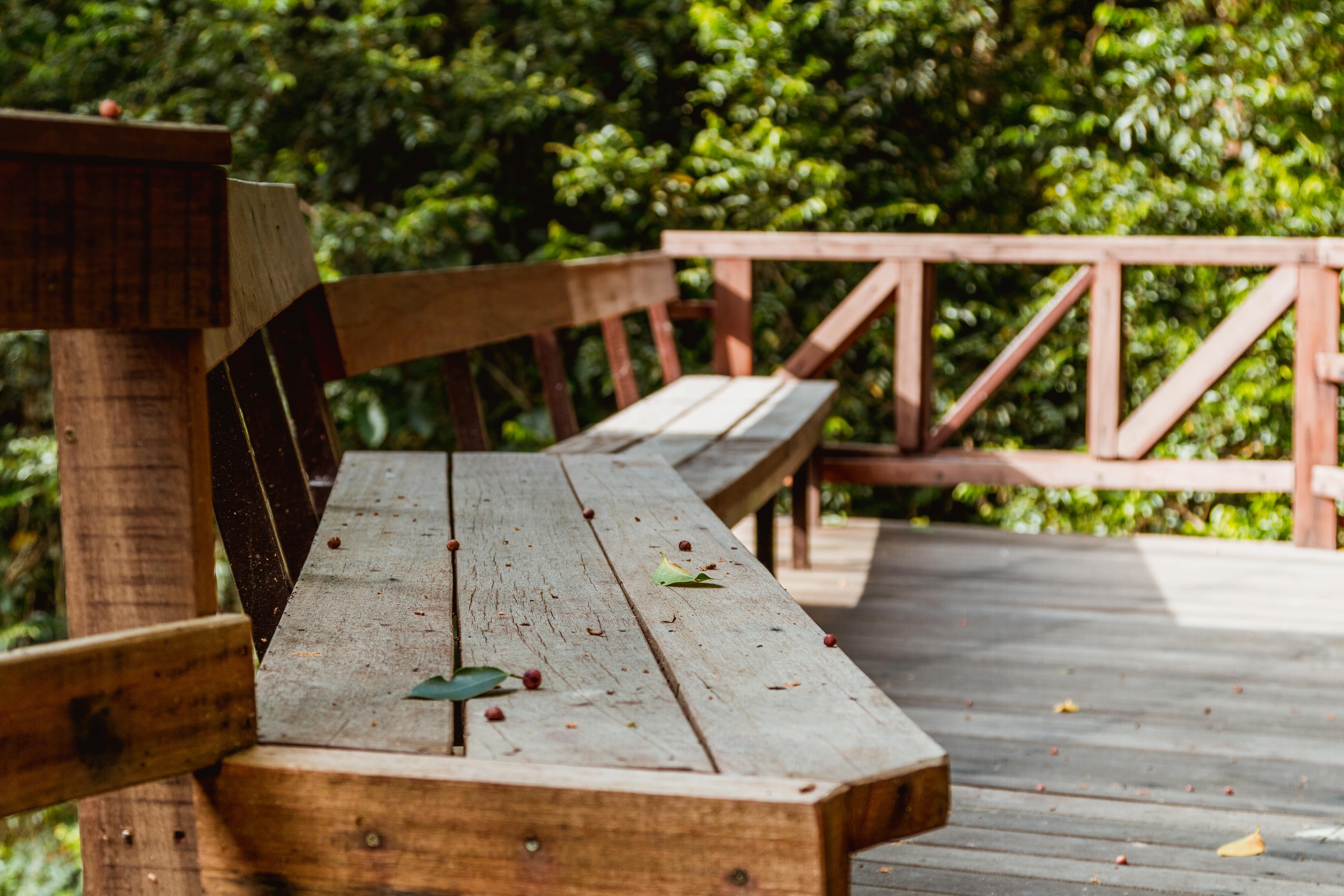 Back deck with wooden railings and built-in benches