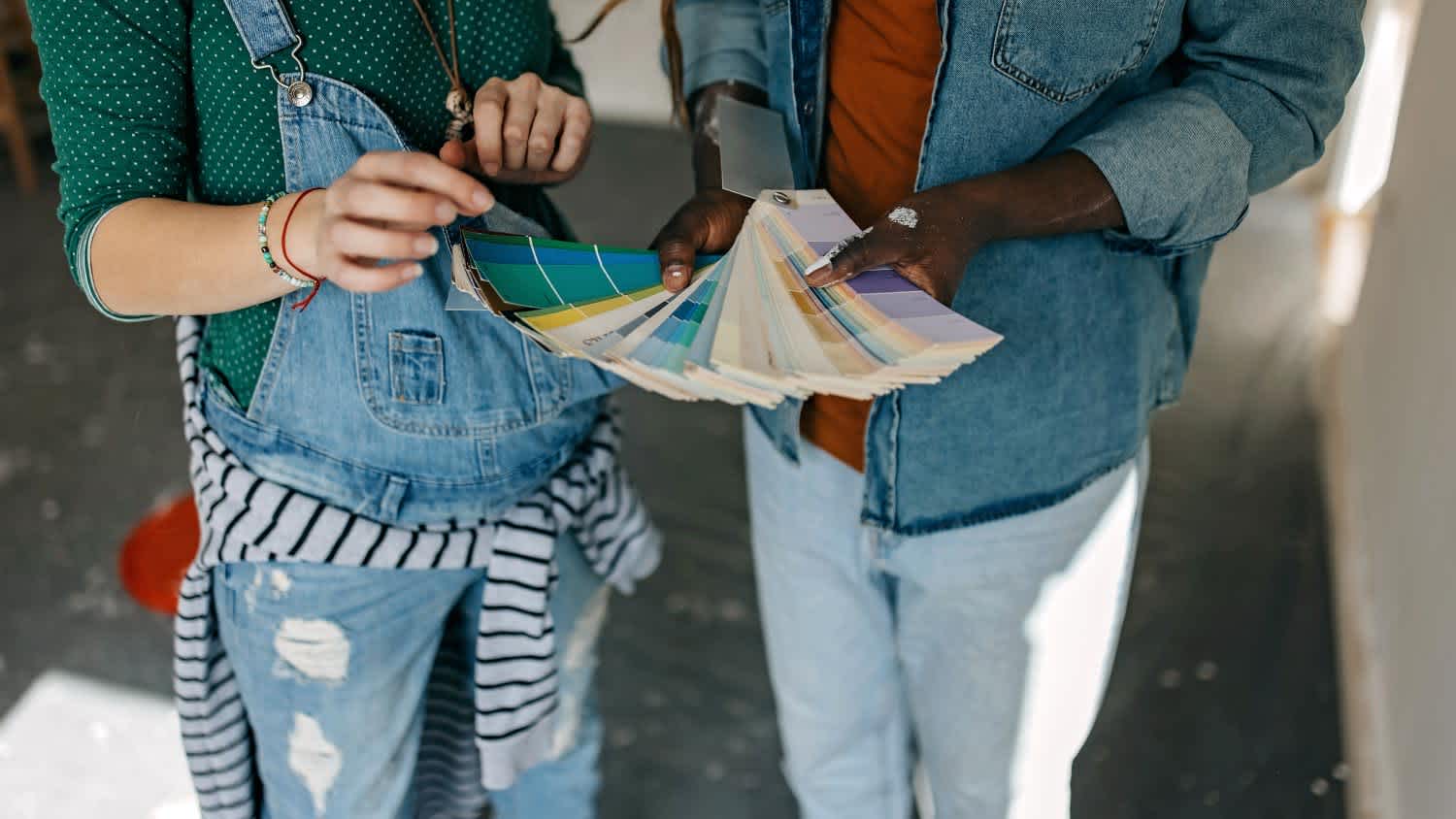 couple choosing paint swatch