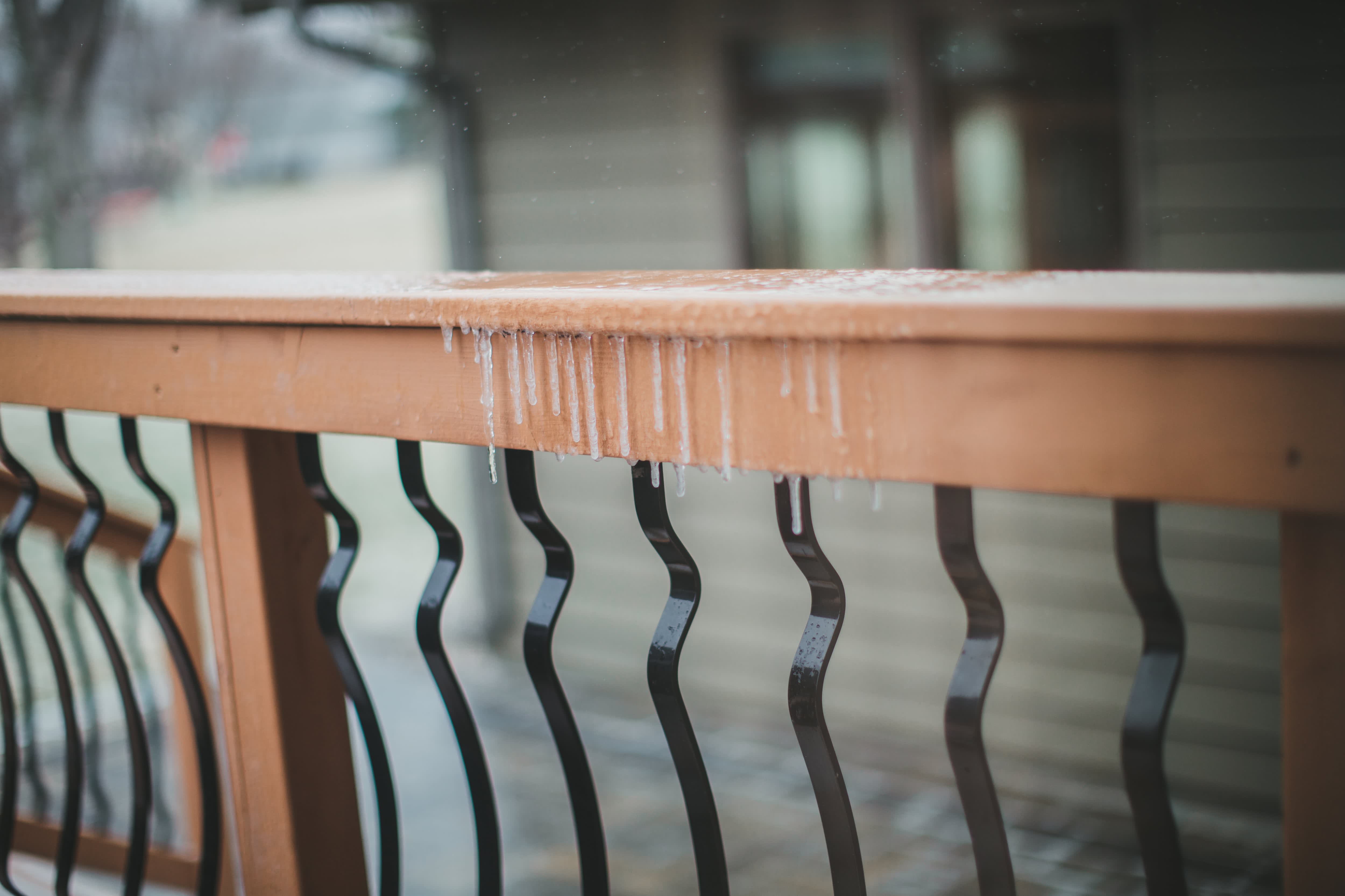 Deck with wavy black metal railing