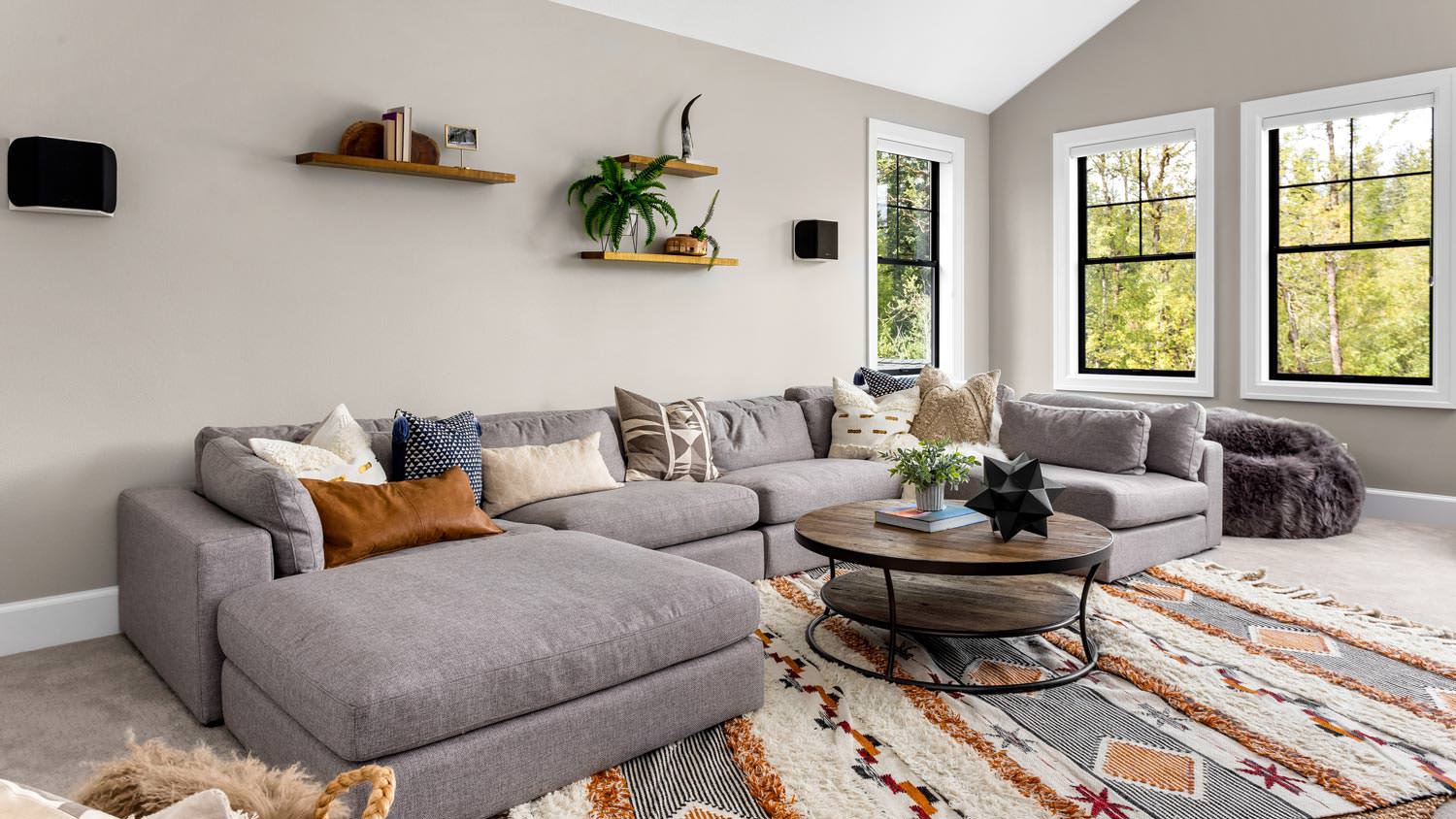 A beautiful living room with a nice sofa and a colorful rug