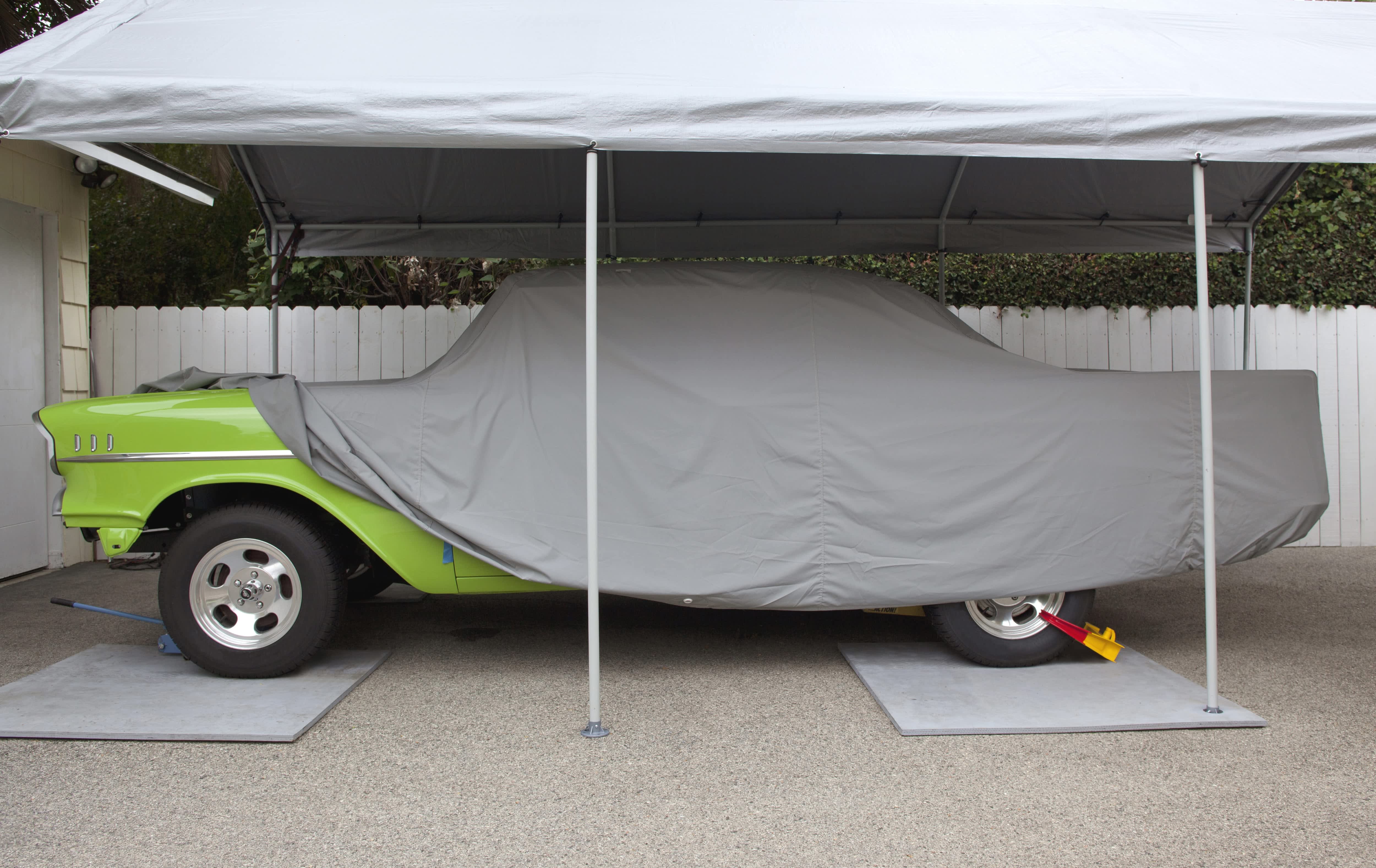 Pop-up carport covering vintage car