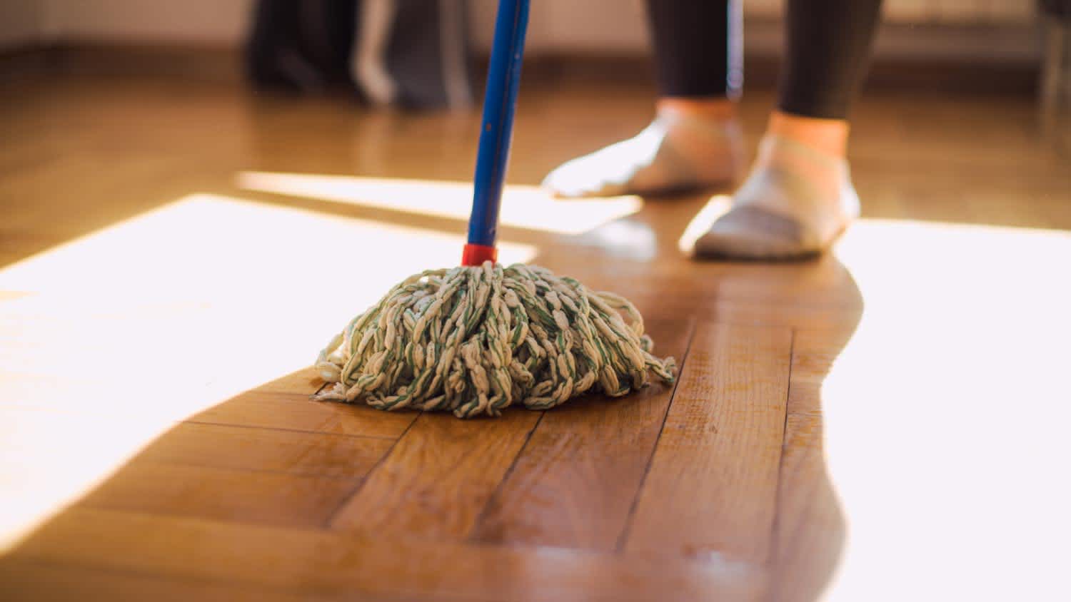A woman wiping the floor