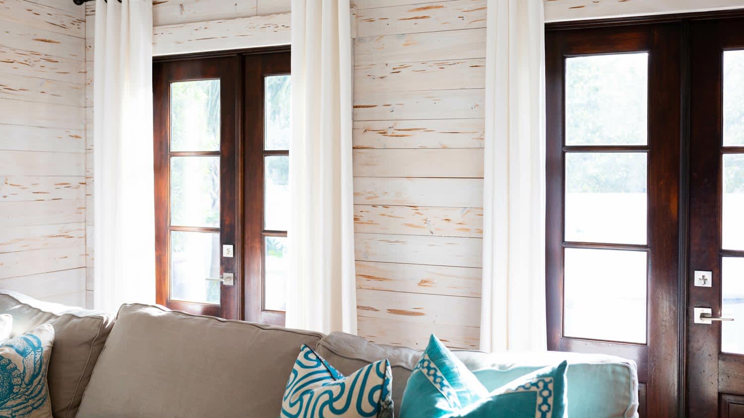 A beach style living room with shiplap