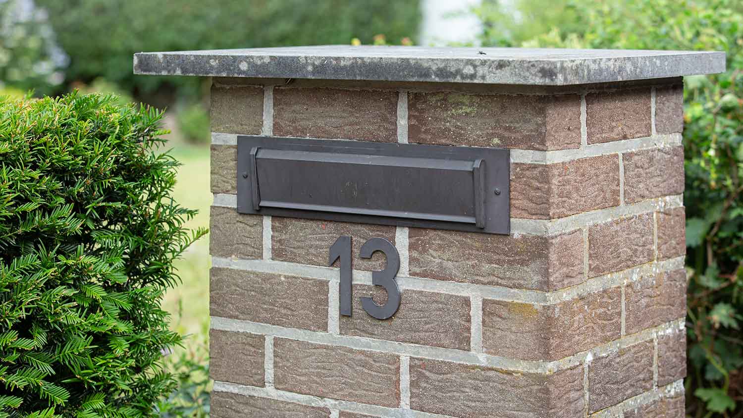 Rear access mailbox on a brick structure
