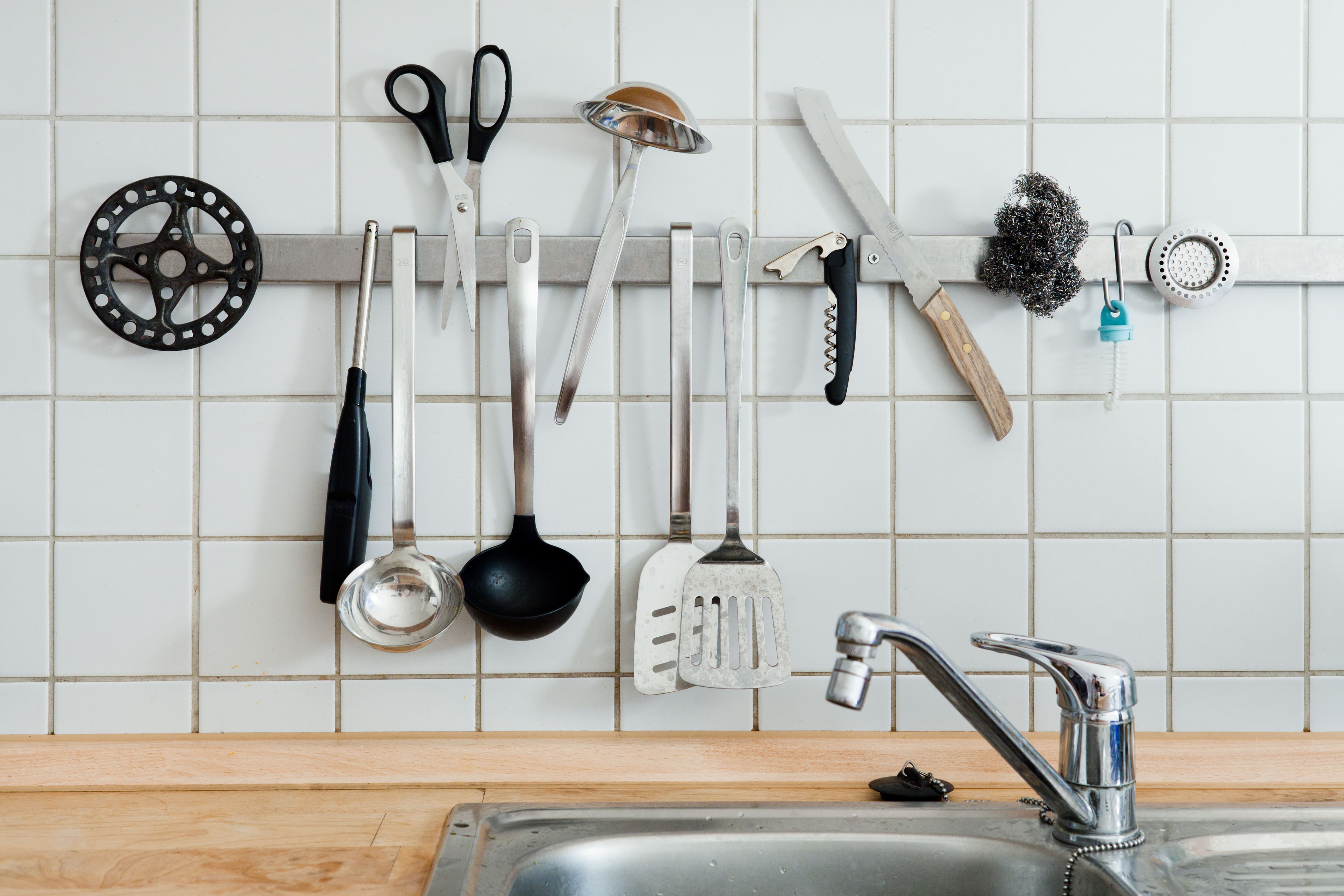 A magnetic strip for kitchen storage with knives, scissors, serving utensils etc.