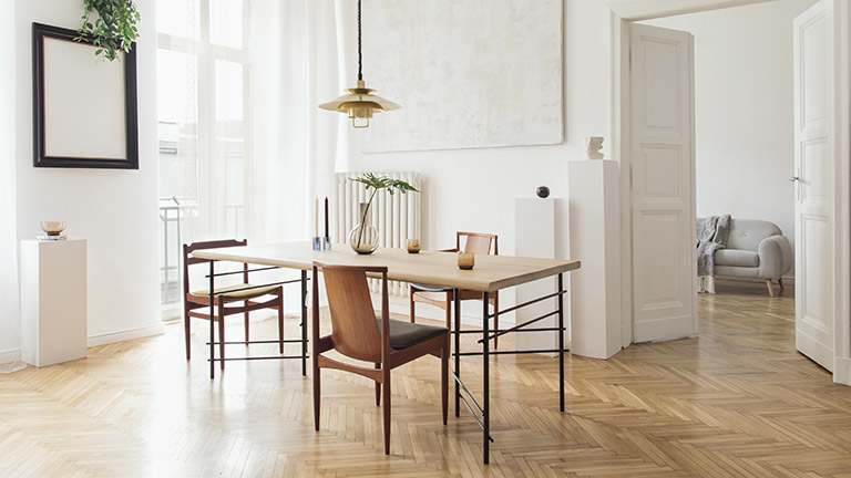 The interior of an eclectic dining room on a sunny day
