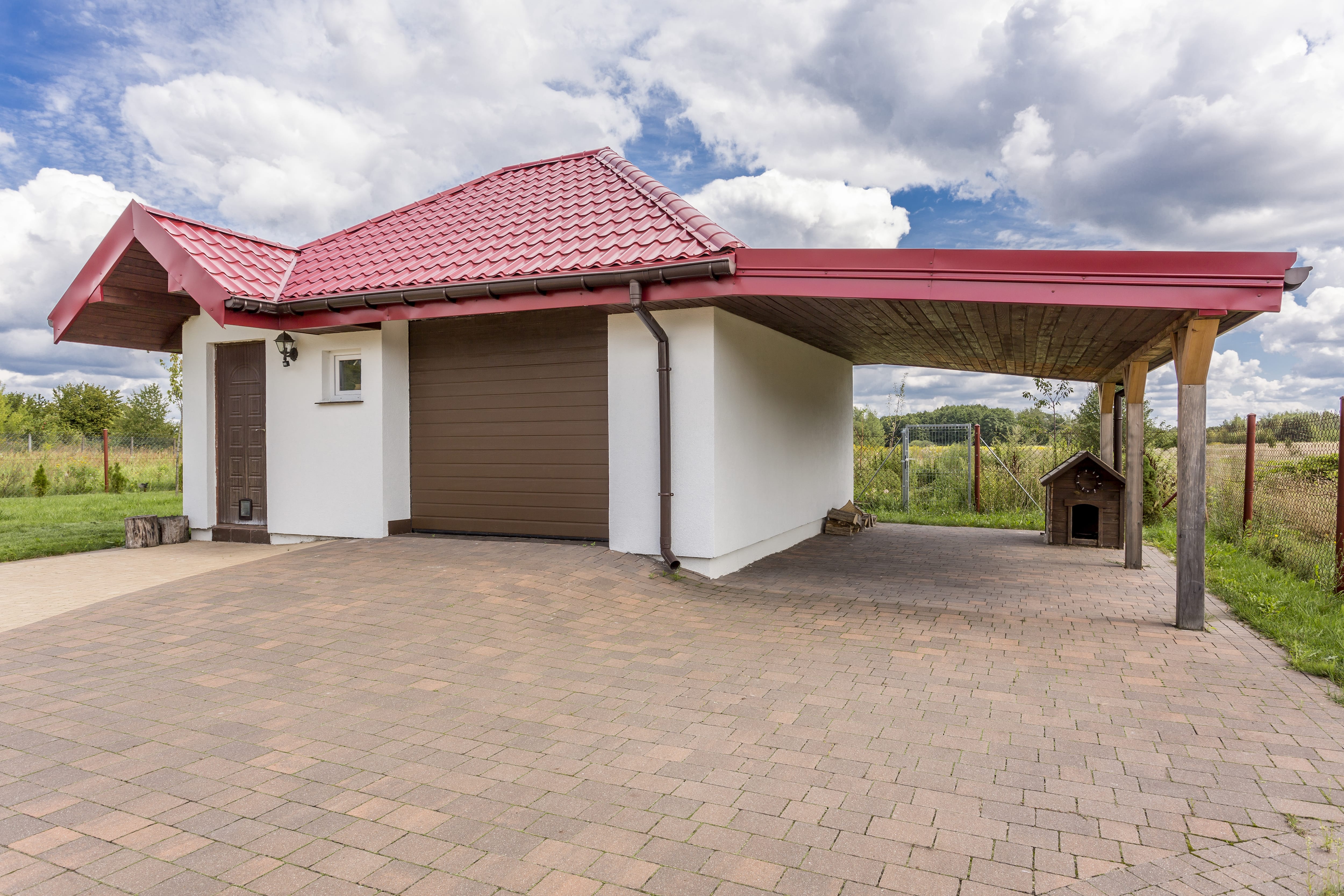 Mediterranean-style carport attached to a garage