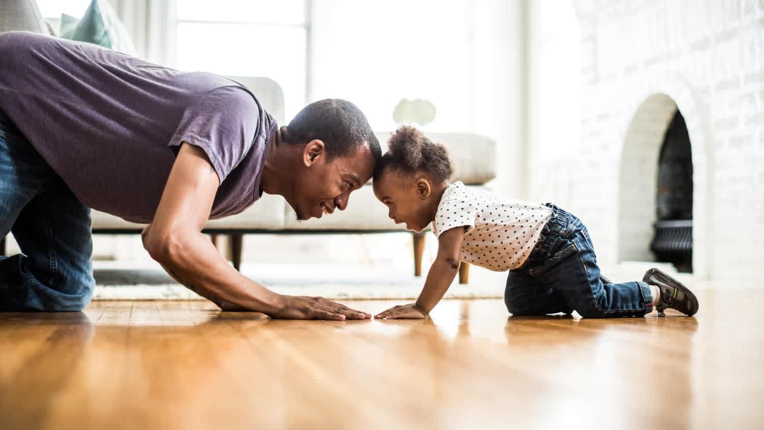 Father and daughter playing on the floor