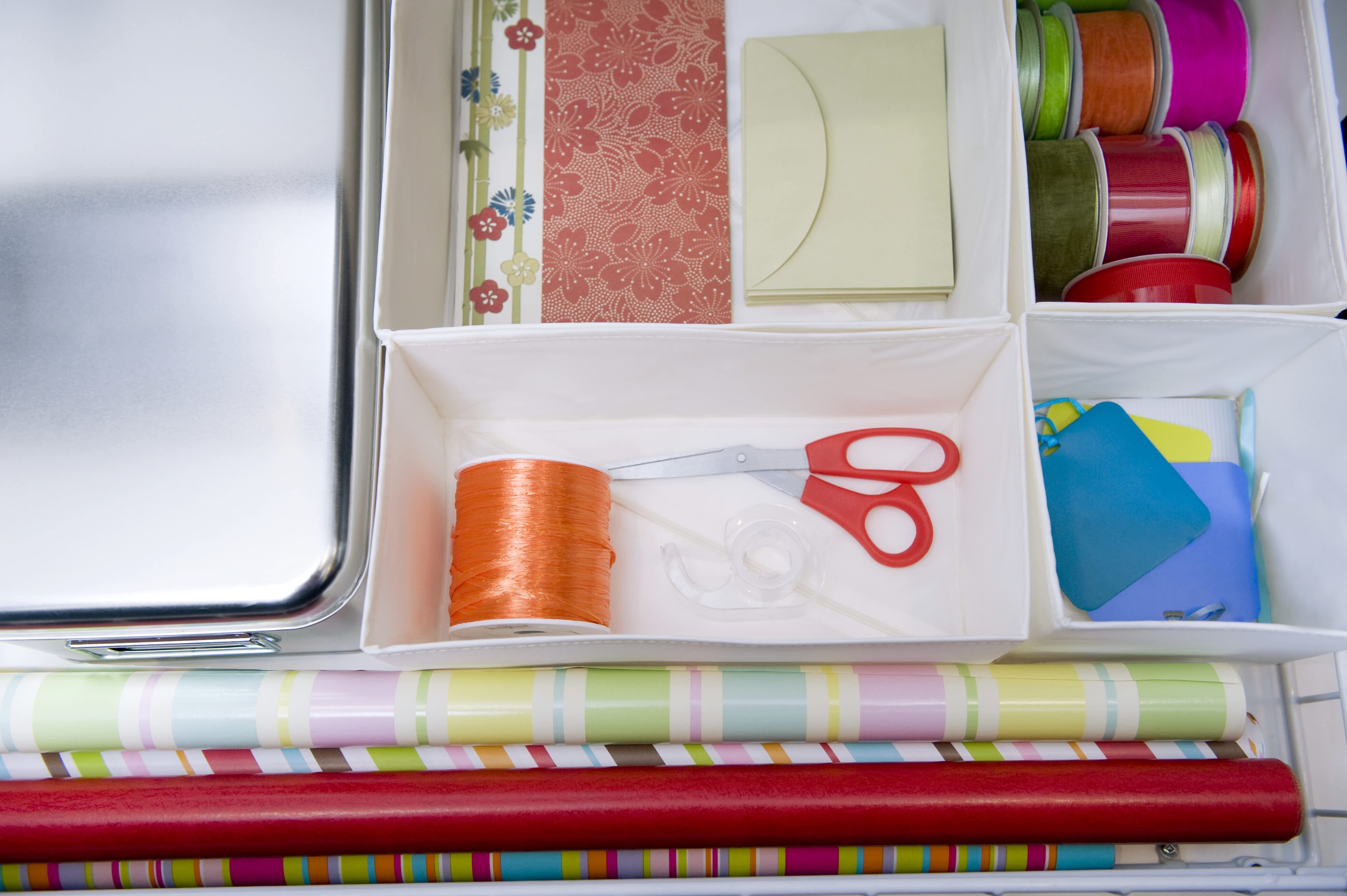 Craft room drawer with organizers for ribbons, wrapping paper, scissors, and materials