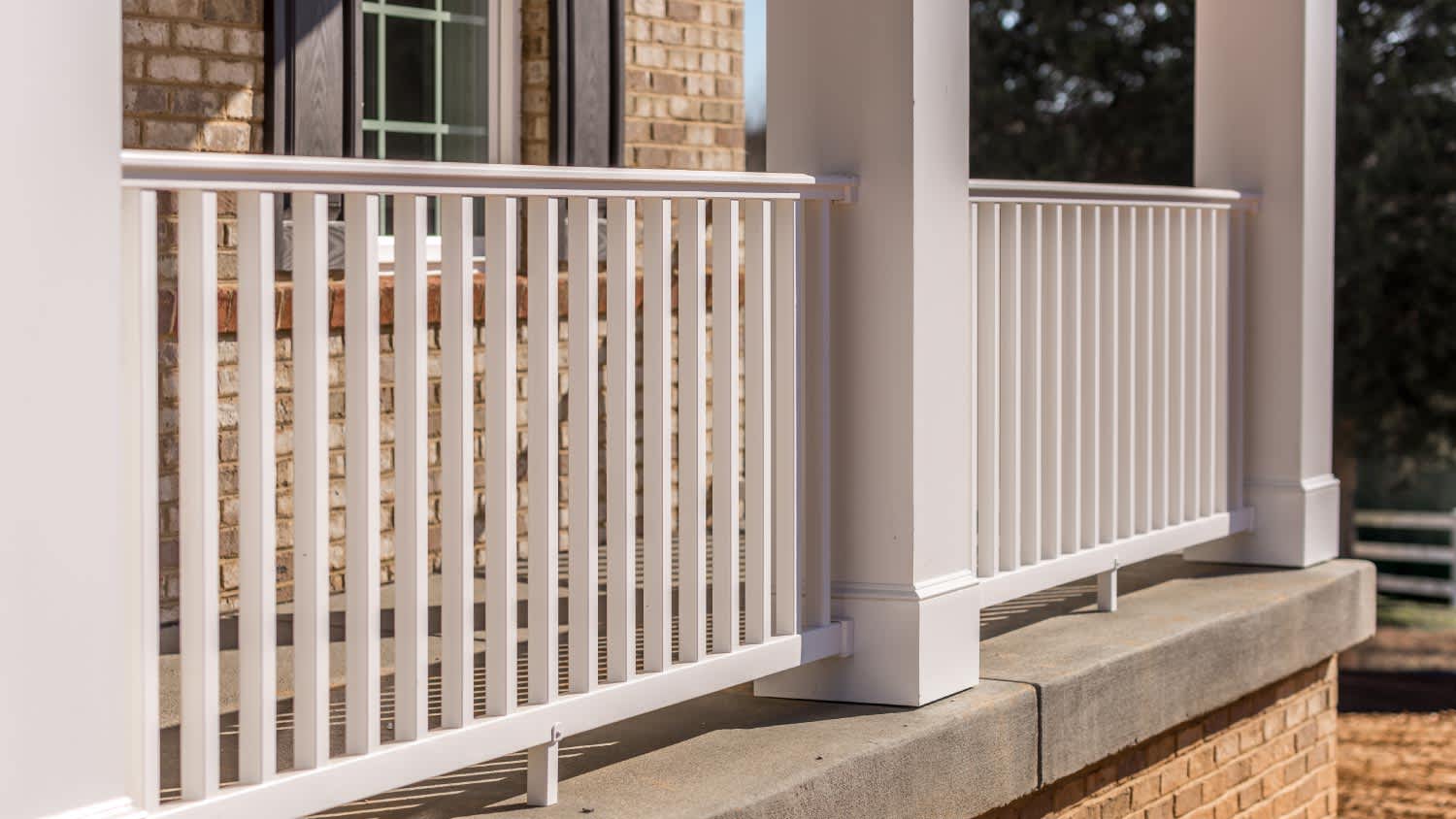 Covered porch with white railing