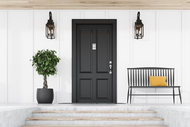 White house with black front door, including different tones of black paint