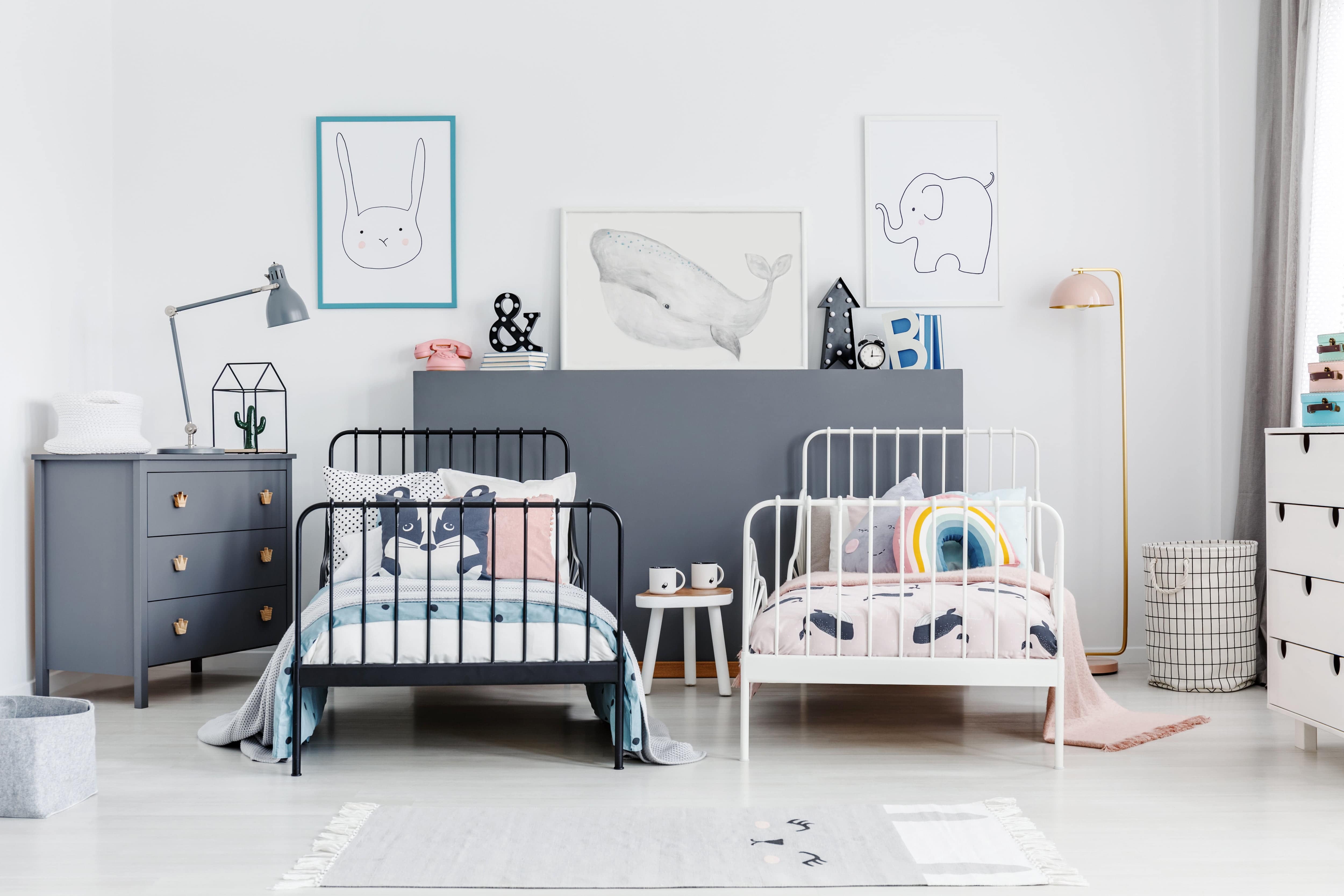 Black-and-white beds in shared bedroom