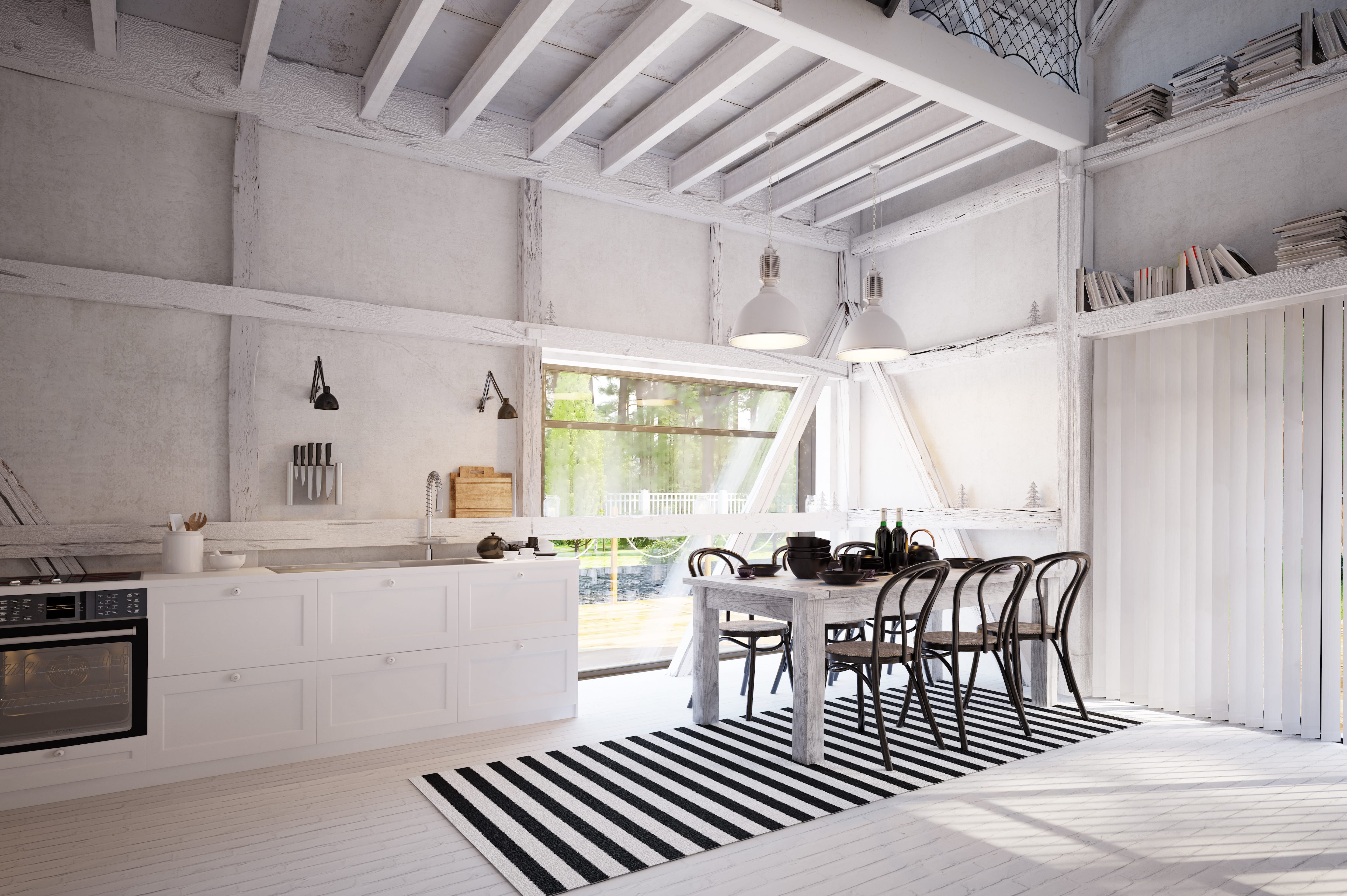 A spacious farmhouse kitchen with black-and-white furniture