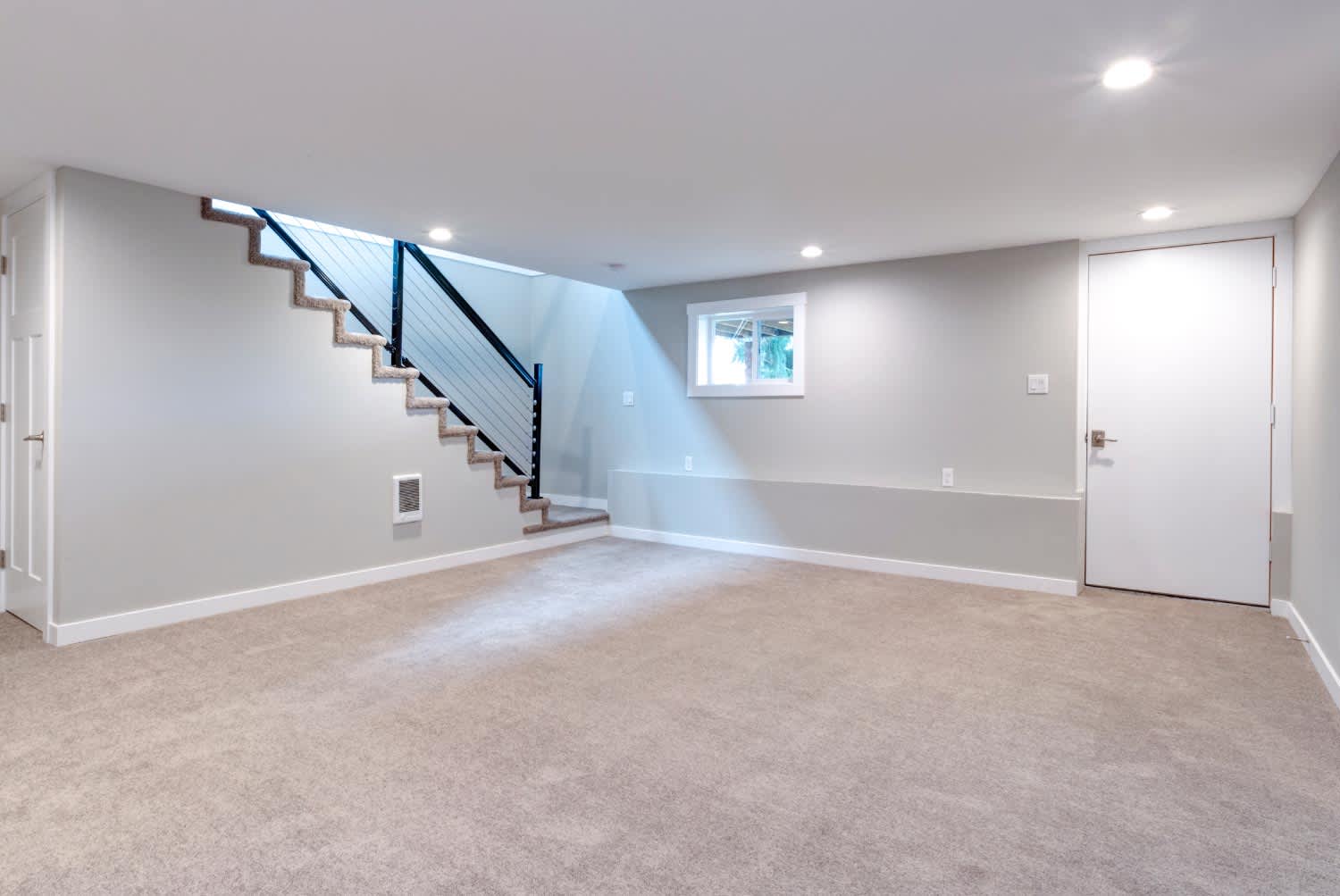 Light spacious basement area with staircase
