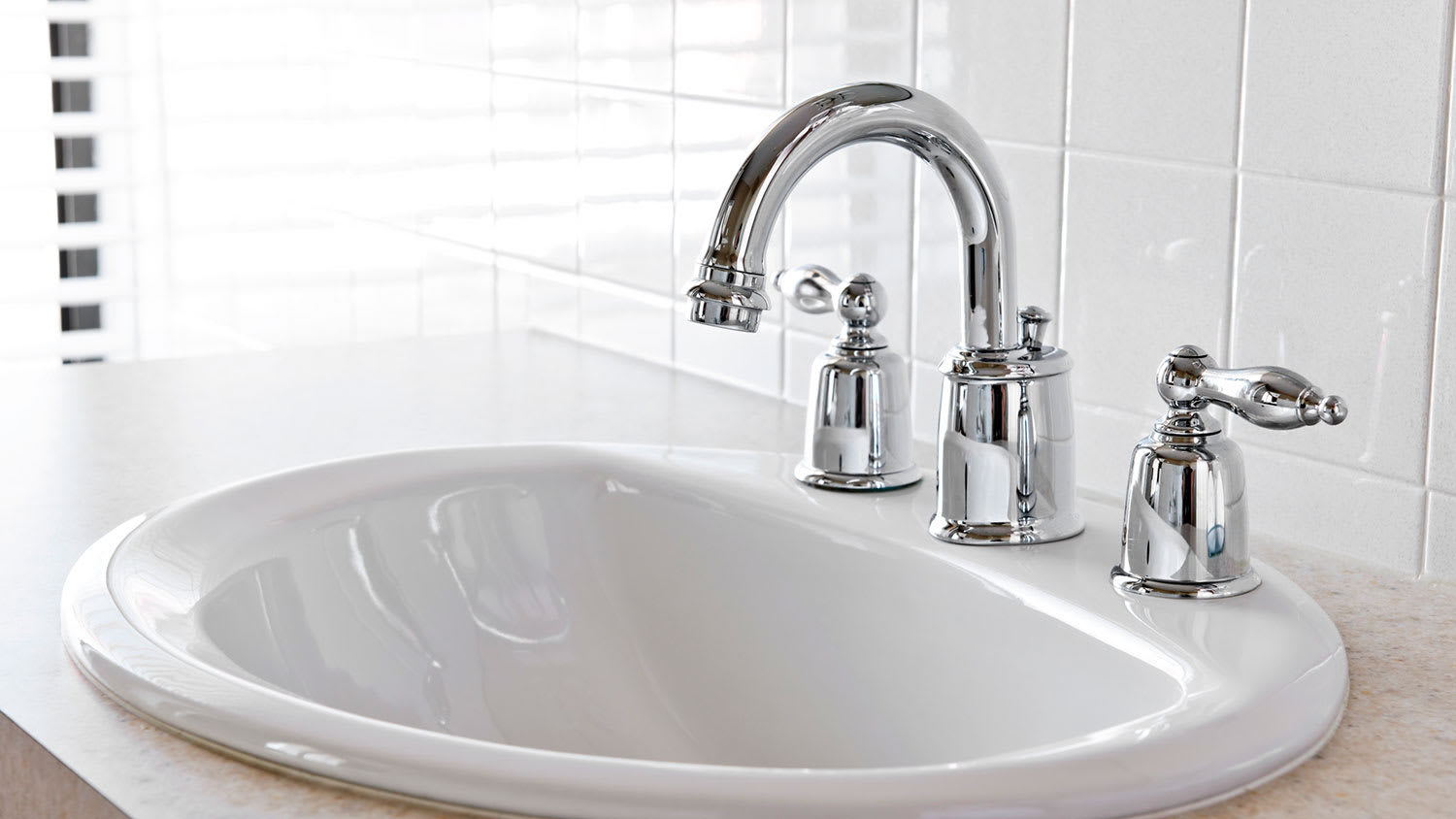 Bathroom sink with chrome fixtures