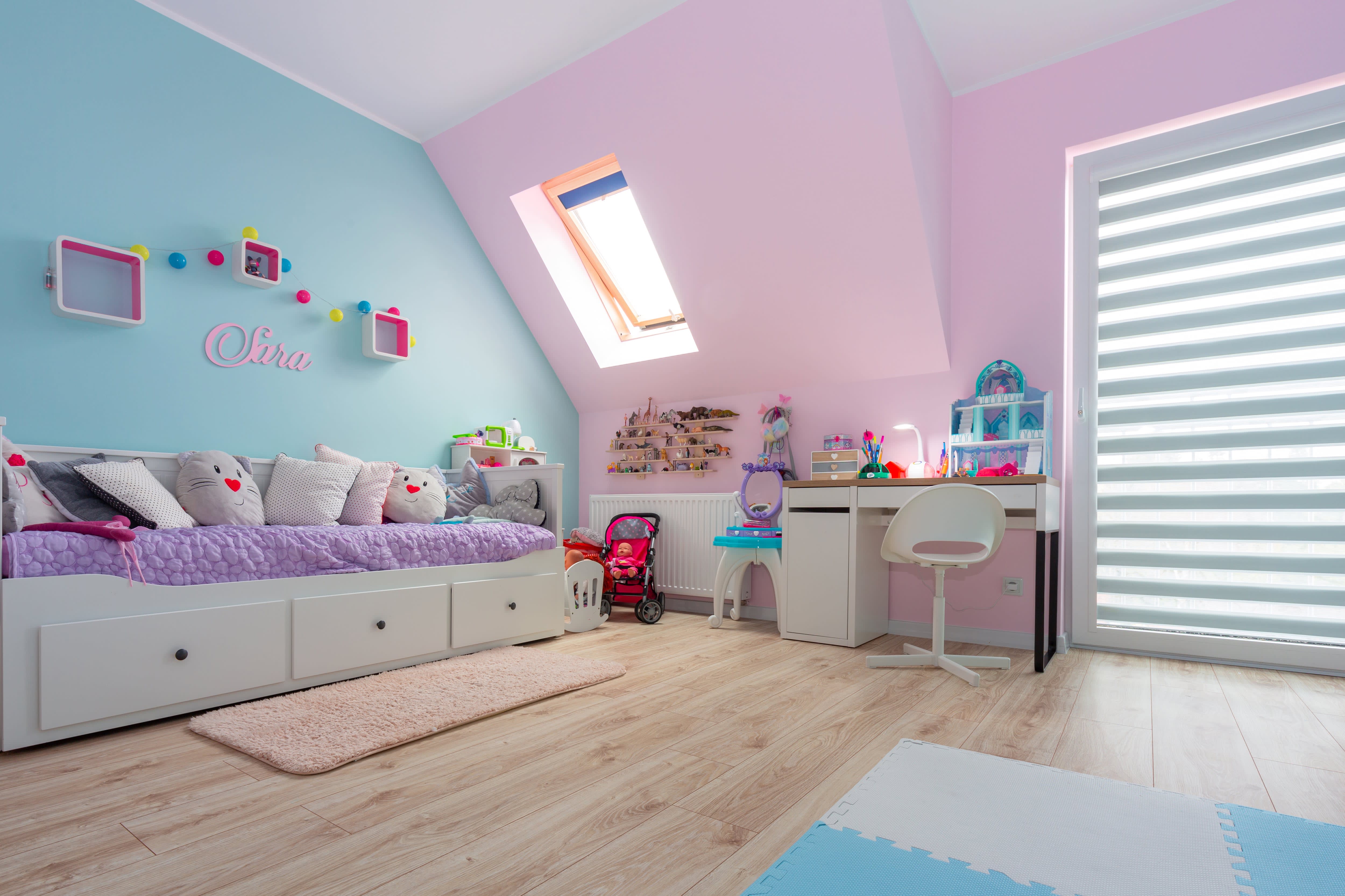 Platform bed in pink and blue kids room