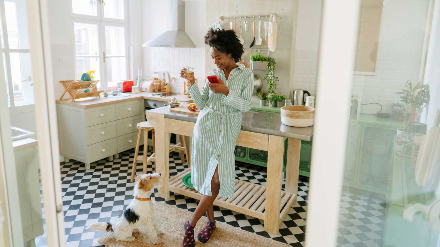 woman with her dog in a vintage kitchen