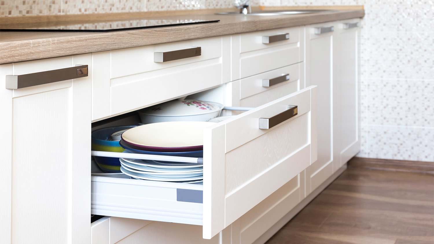 white kitchen with silver hardware