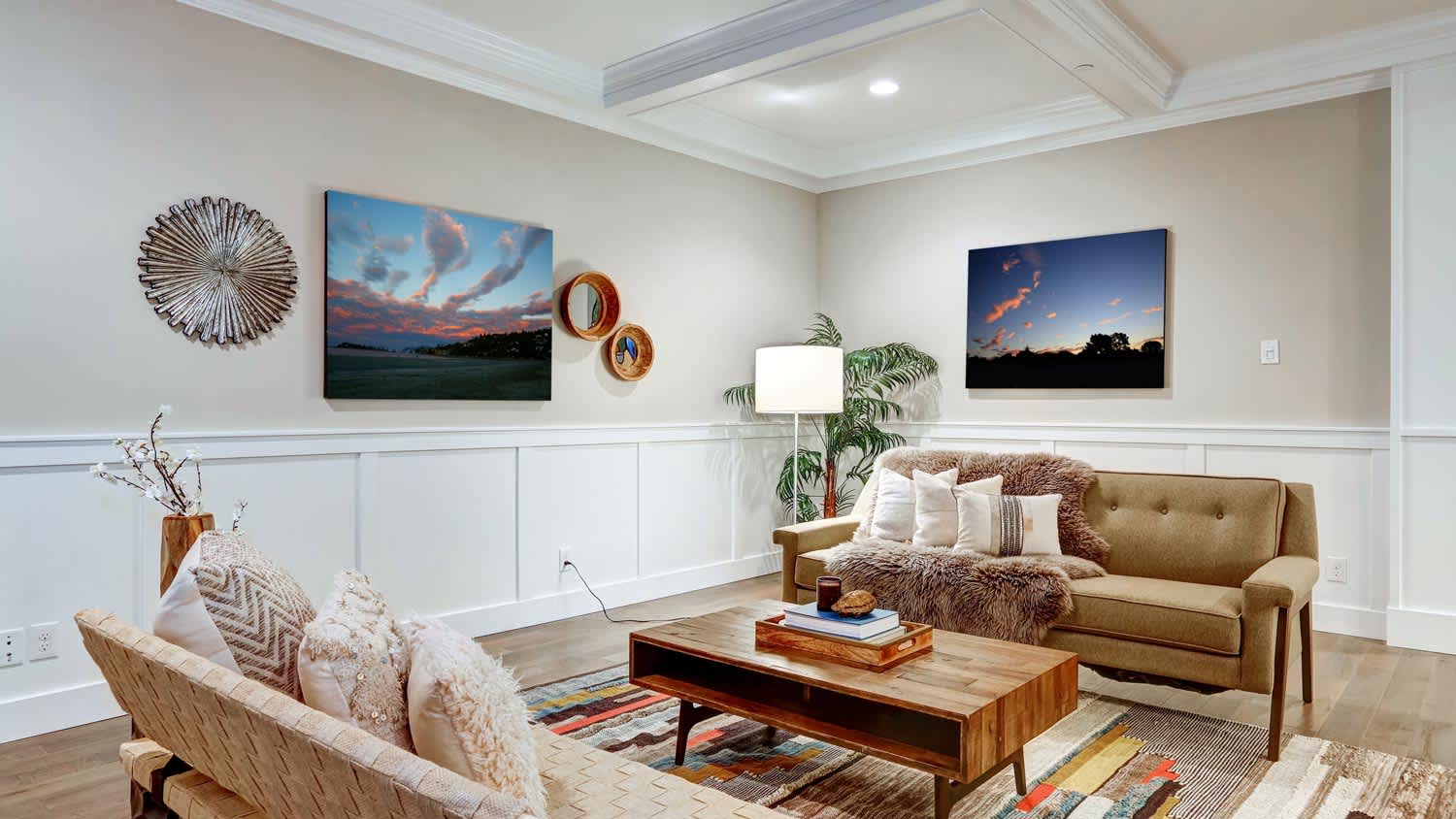 A living room with wainscoting and coffered ceiling