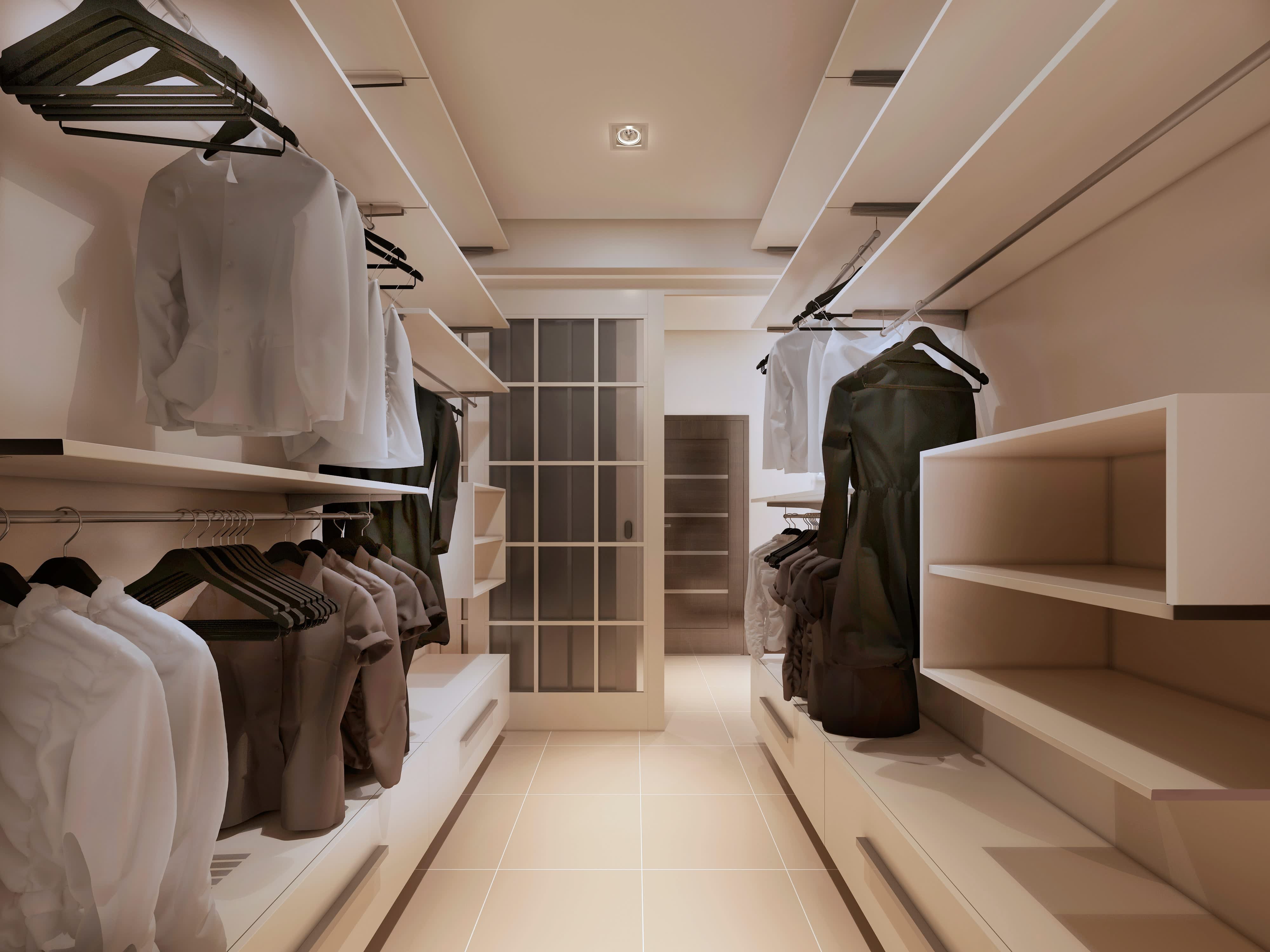 A walk-in closet with modern floating shelves