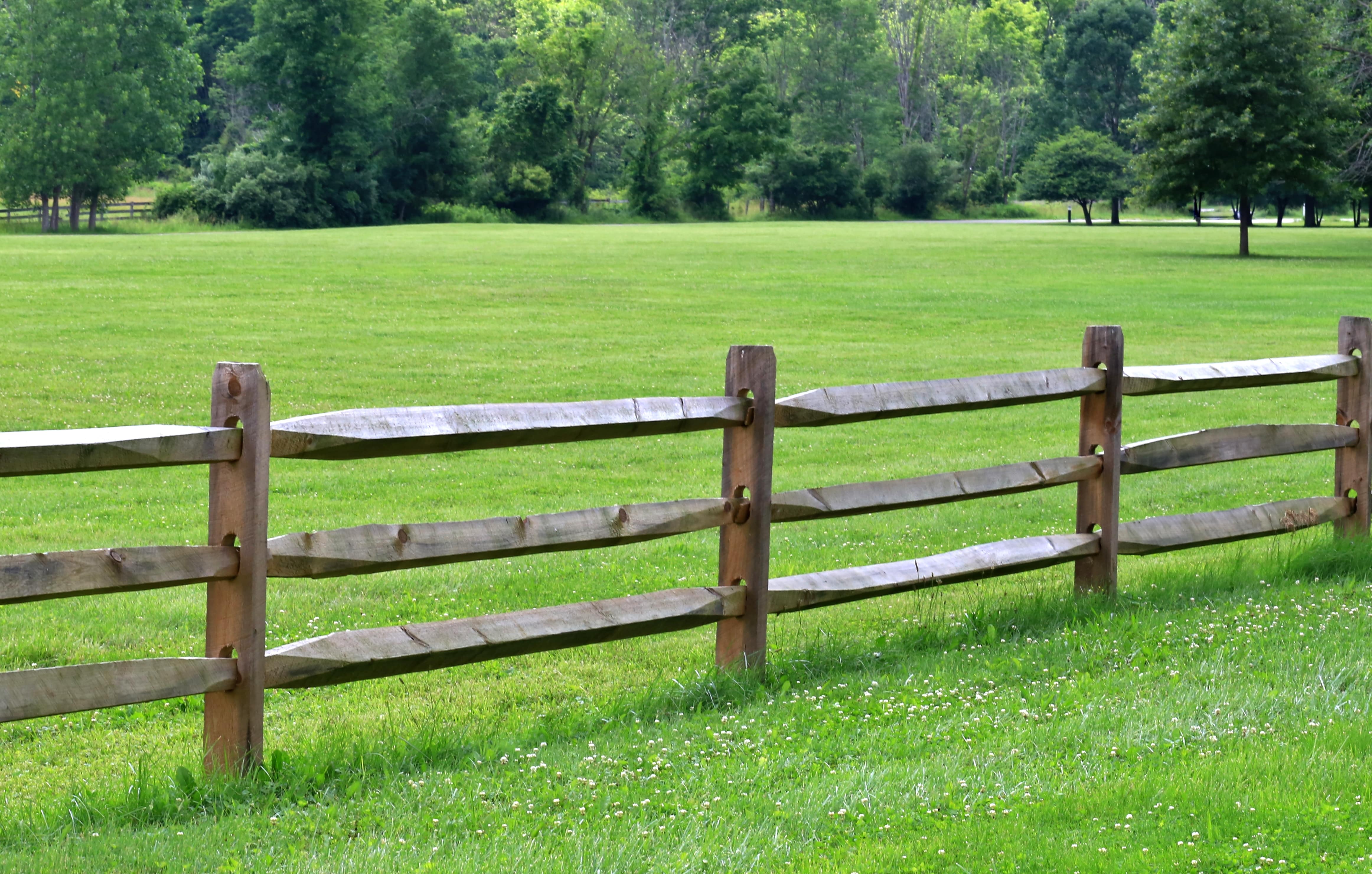 Natural split-rail fence surrounding large property